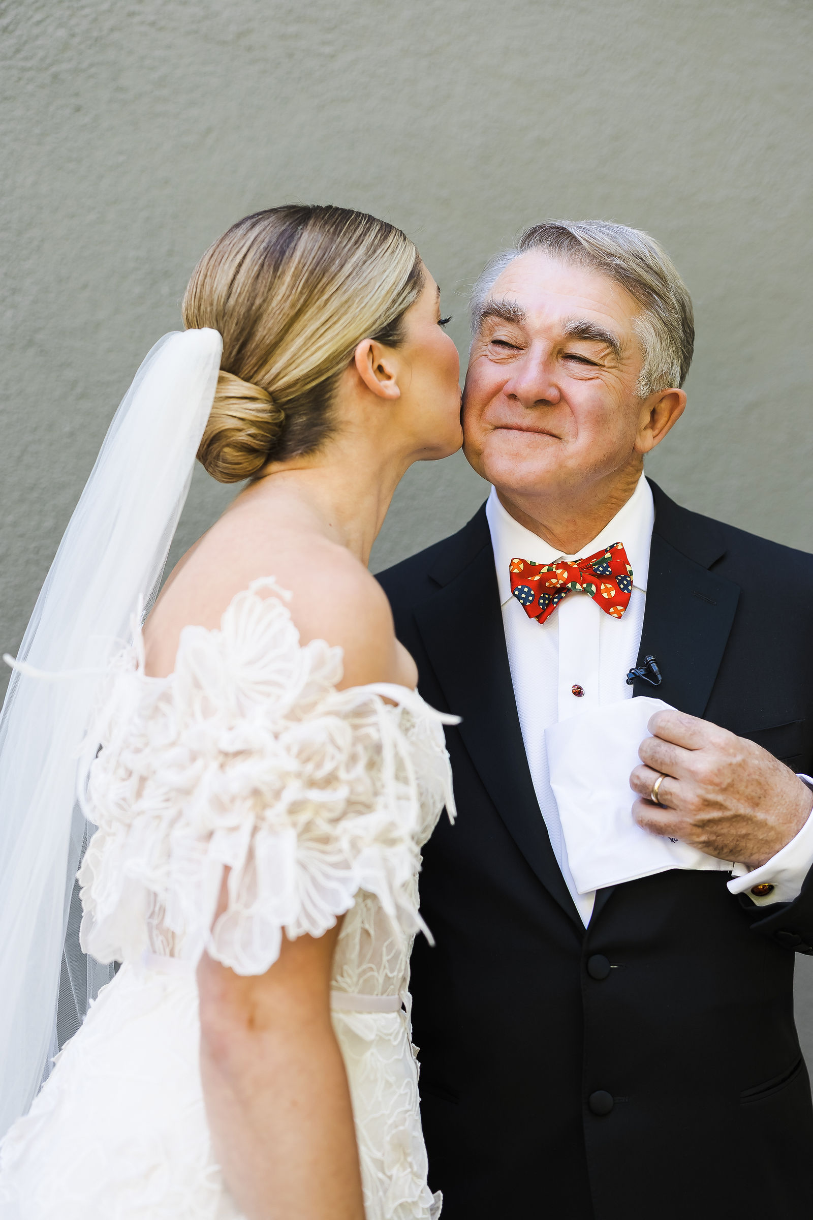 Bride with her father before the ceremony, wearing an orange floral bow tie, Healdsburg wedding photographer