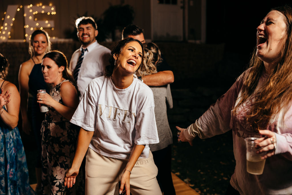 Heather dancing in her WIFEY shirt