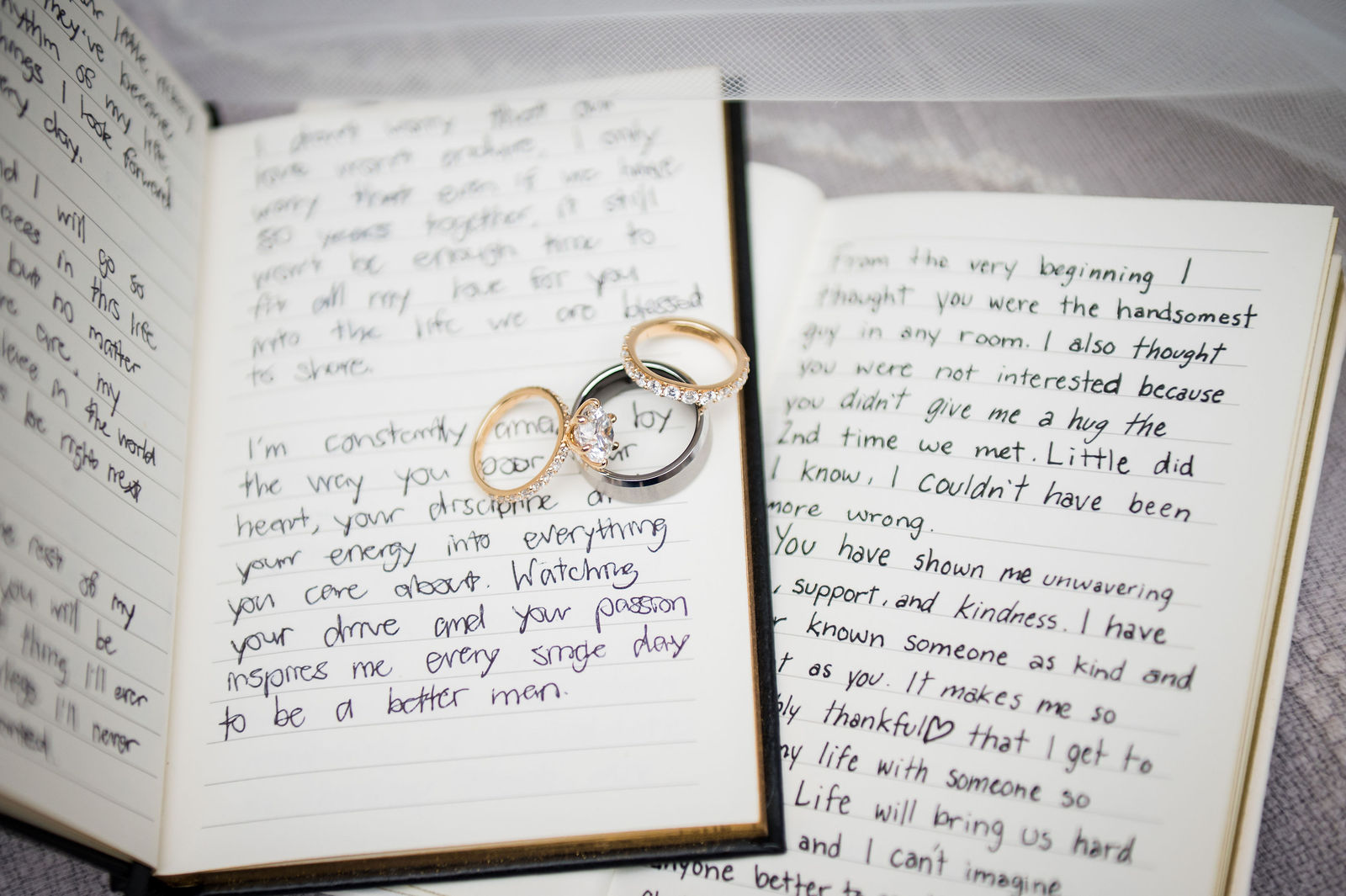 Handwritten wedding vow books with rings at a Castle Rock Colorado wedding