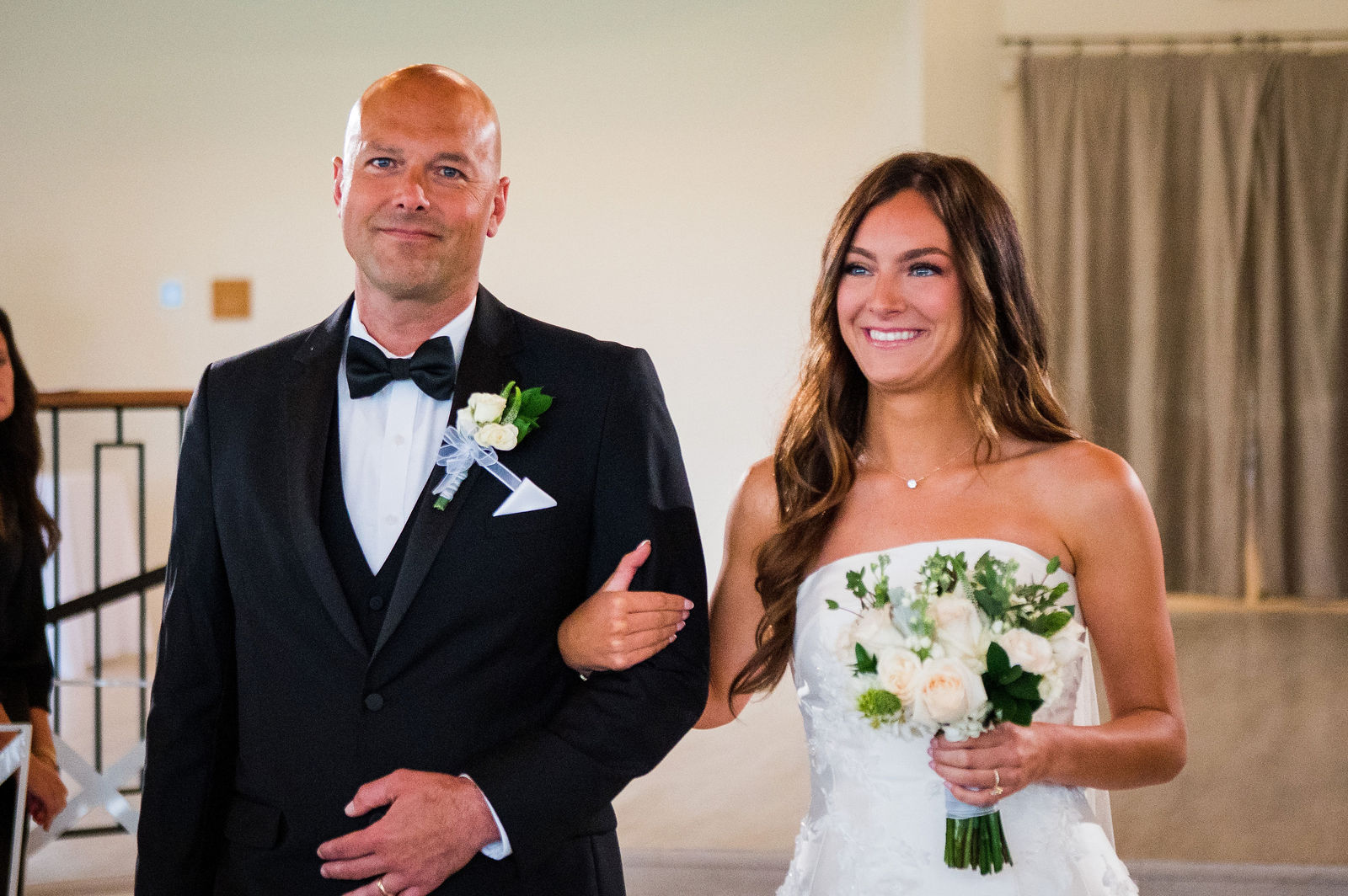 Bride and her father arm in arm at a black tie Colorado wedding
