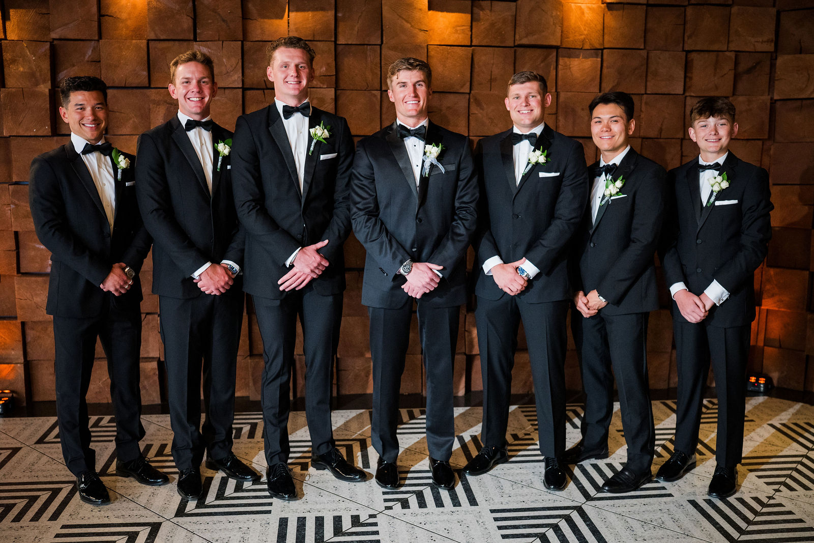 Groomsmen in black tie at The Oaks at Plum Creek in Castle Rock Colorado