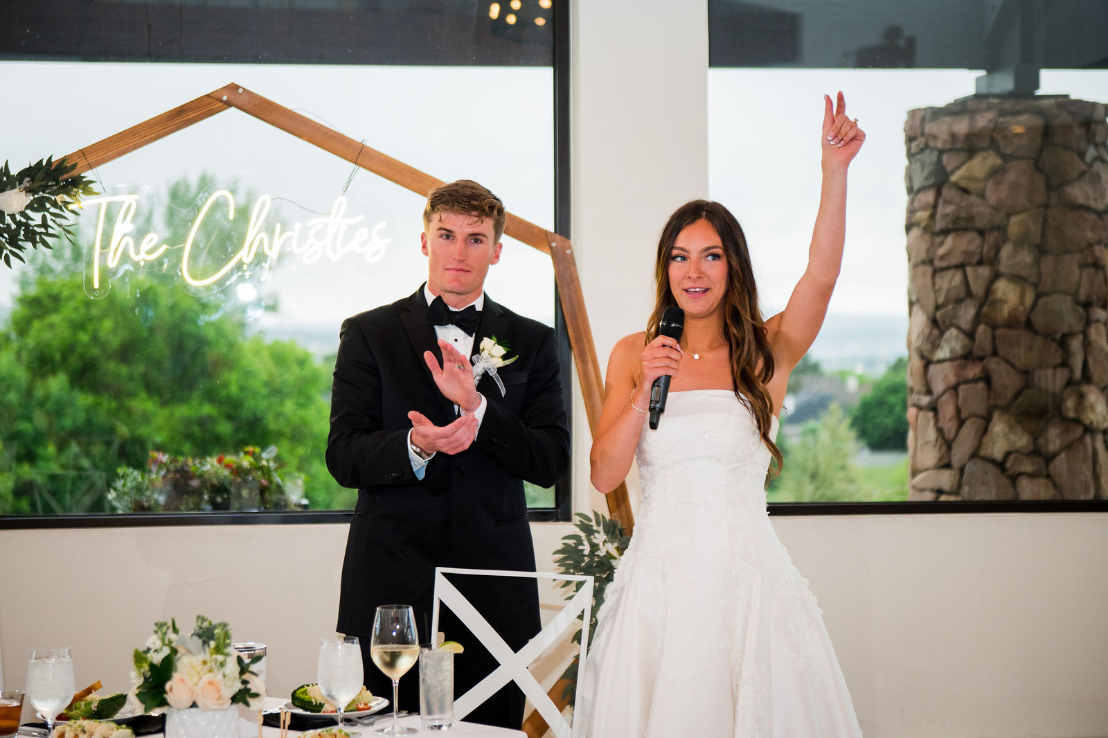 Bride and groom giving a speech at their Castle Rock Colorado wedding