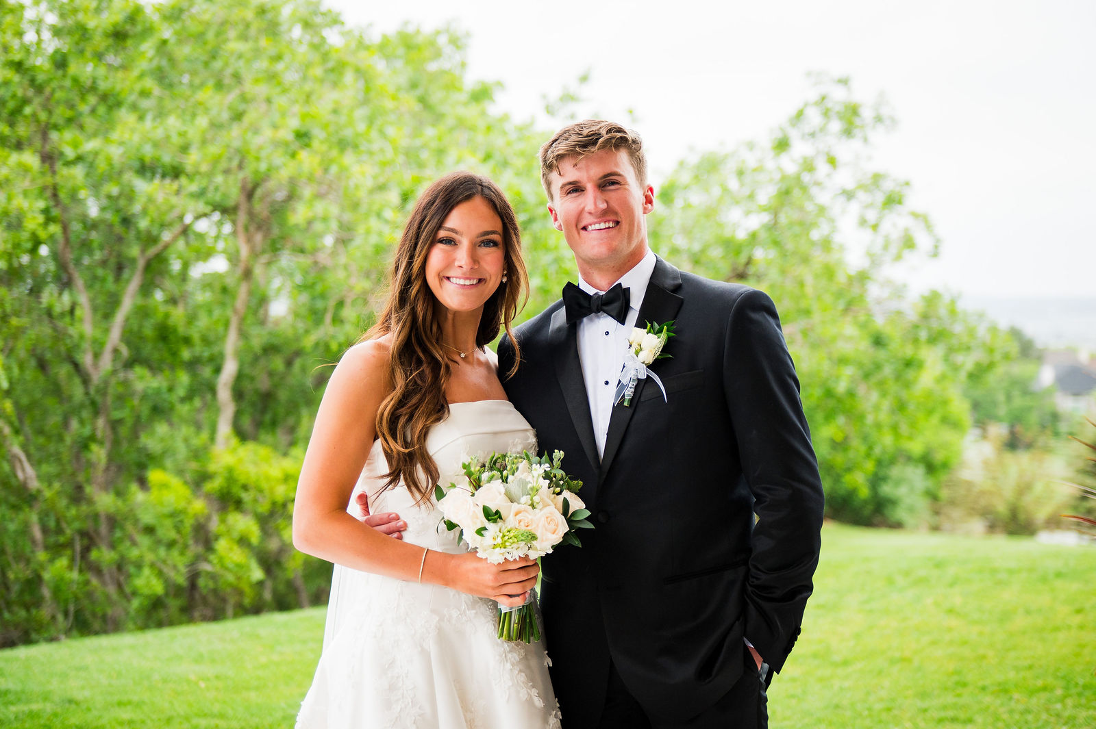 Bride and groom portrait on the lawn at The Oaks at Plum Creek Castle Rock
