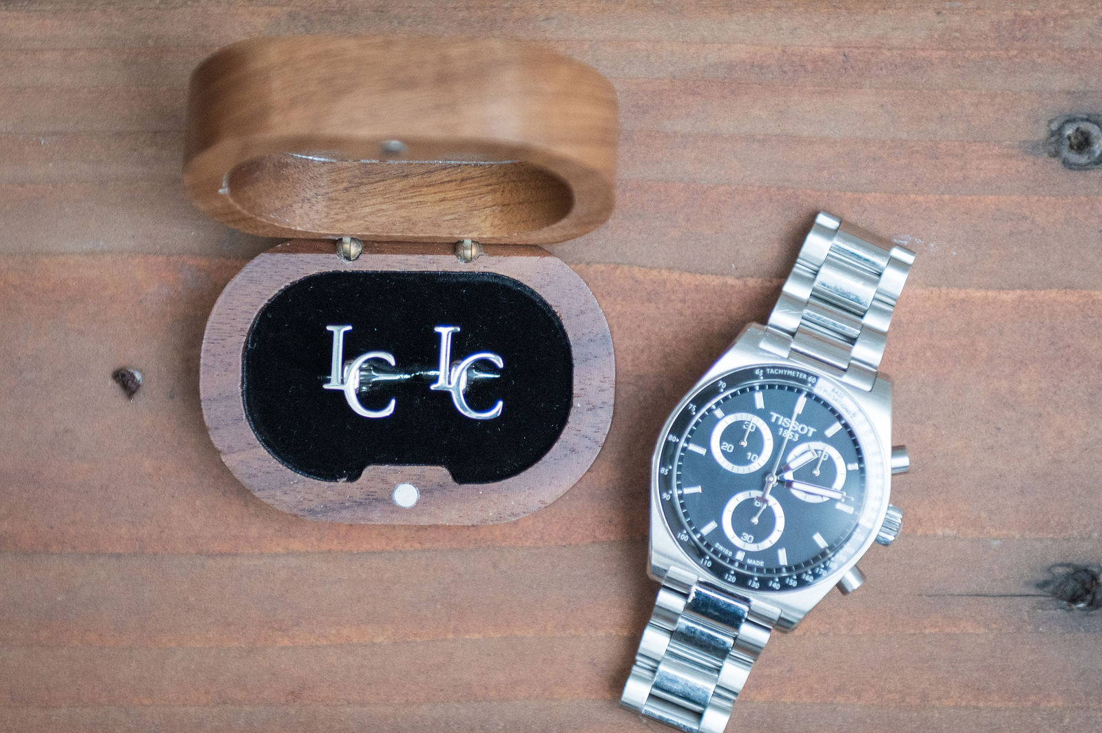 Groom’s watch and monogrammed ring box at The Oaks at Plum Creek