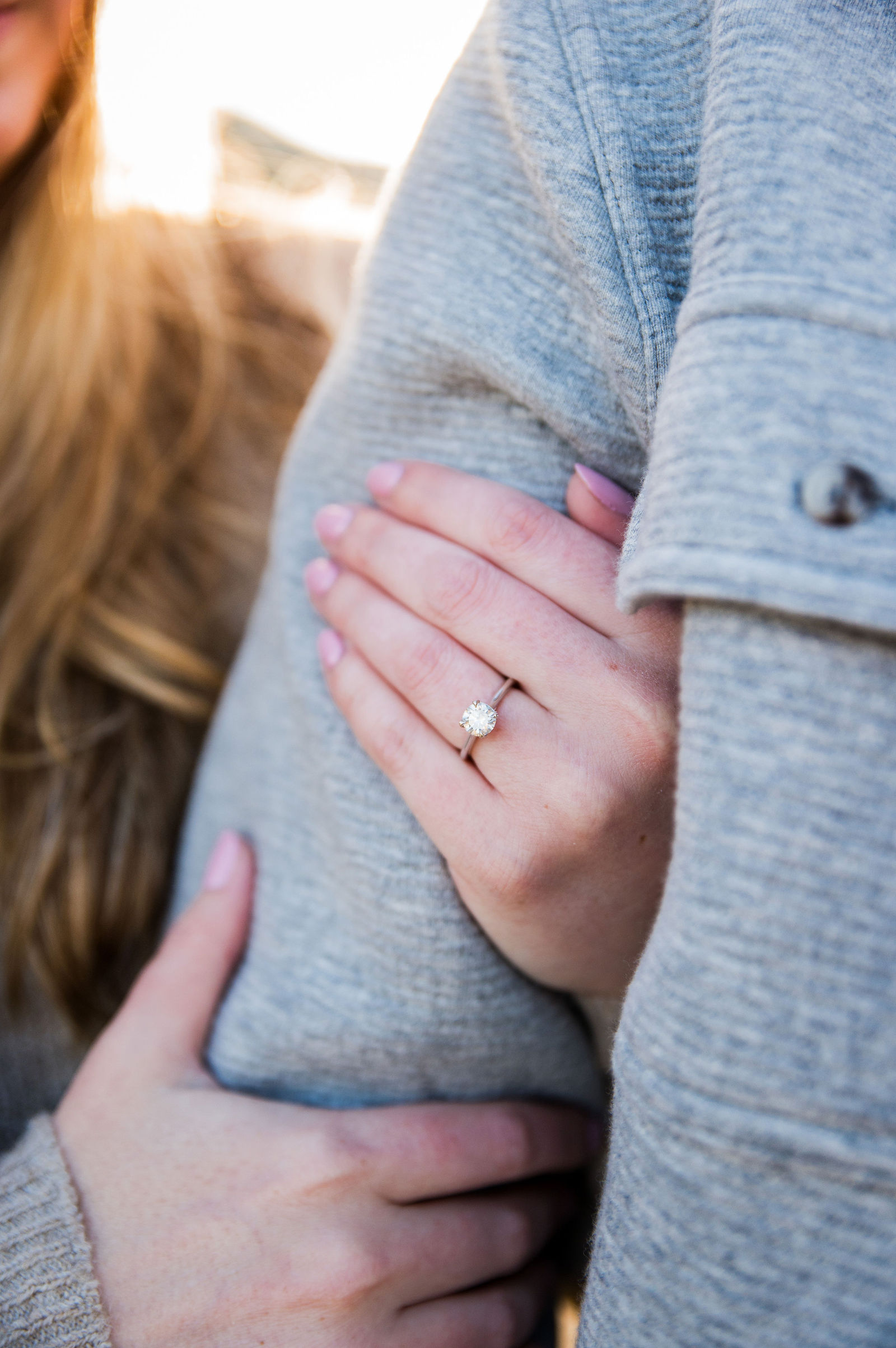 Close up of an engagement ring on a newly engaged bride to be in Colorado