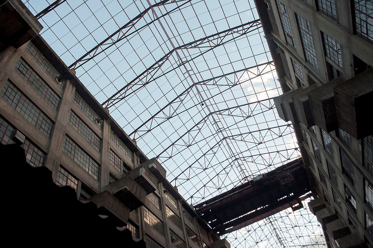 Spacious loft interior with skylights and industrial features.
