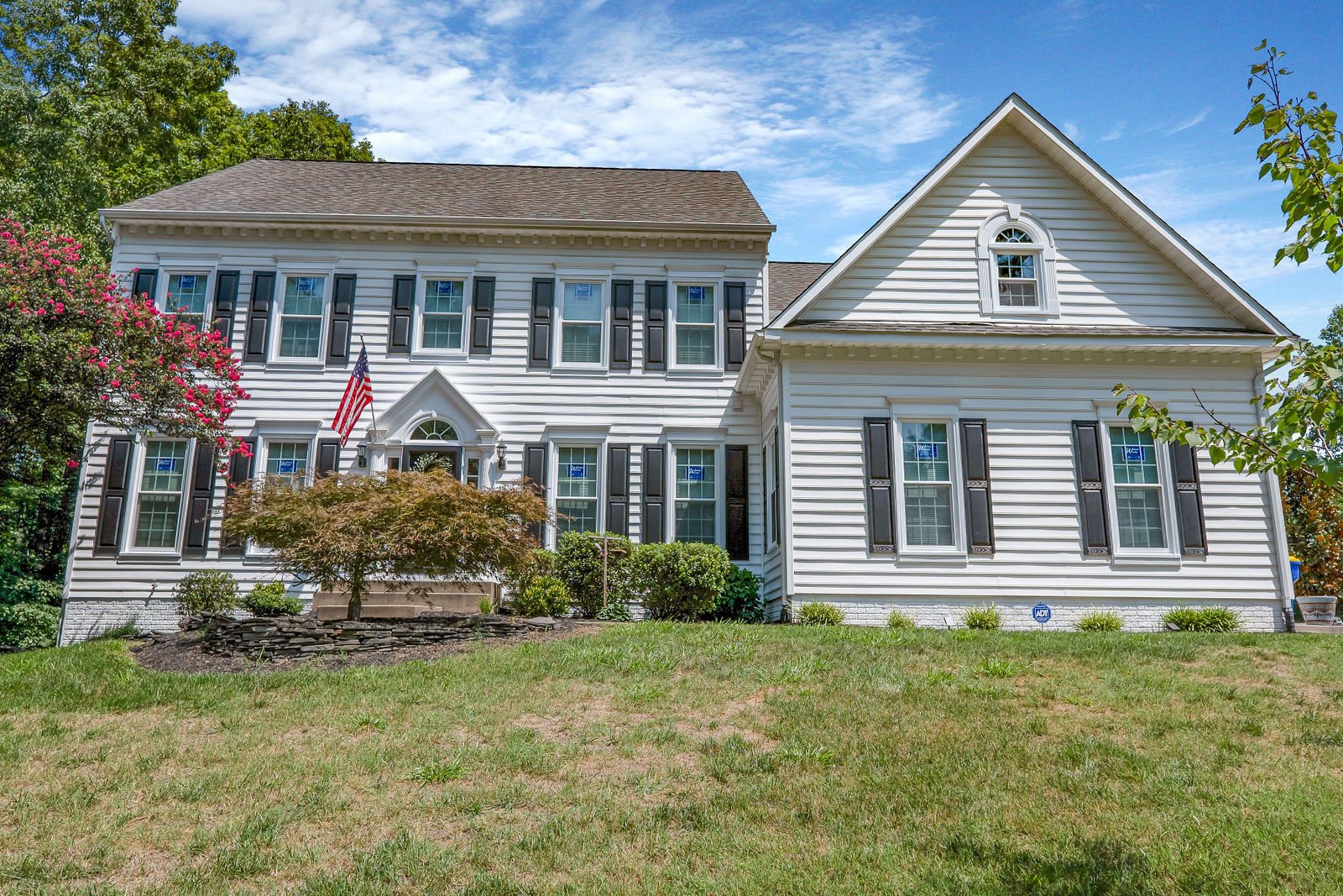 Colonial home exterior with new windows
