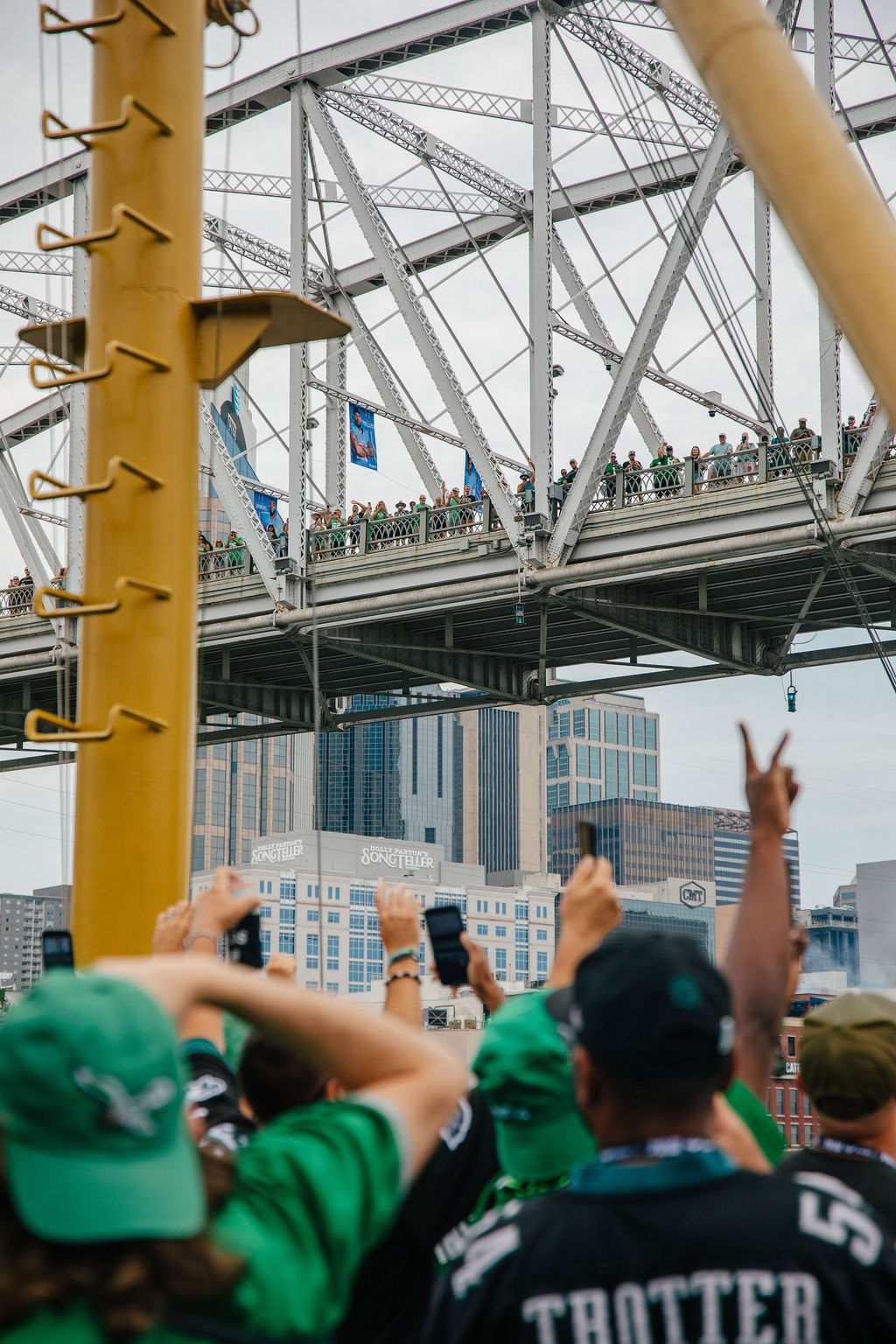 Event photography company covering a large crowd on a Nashville bridge during a fan event