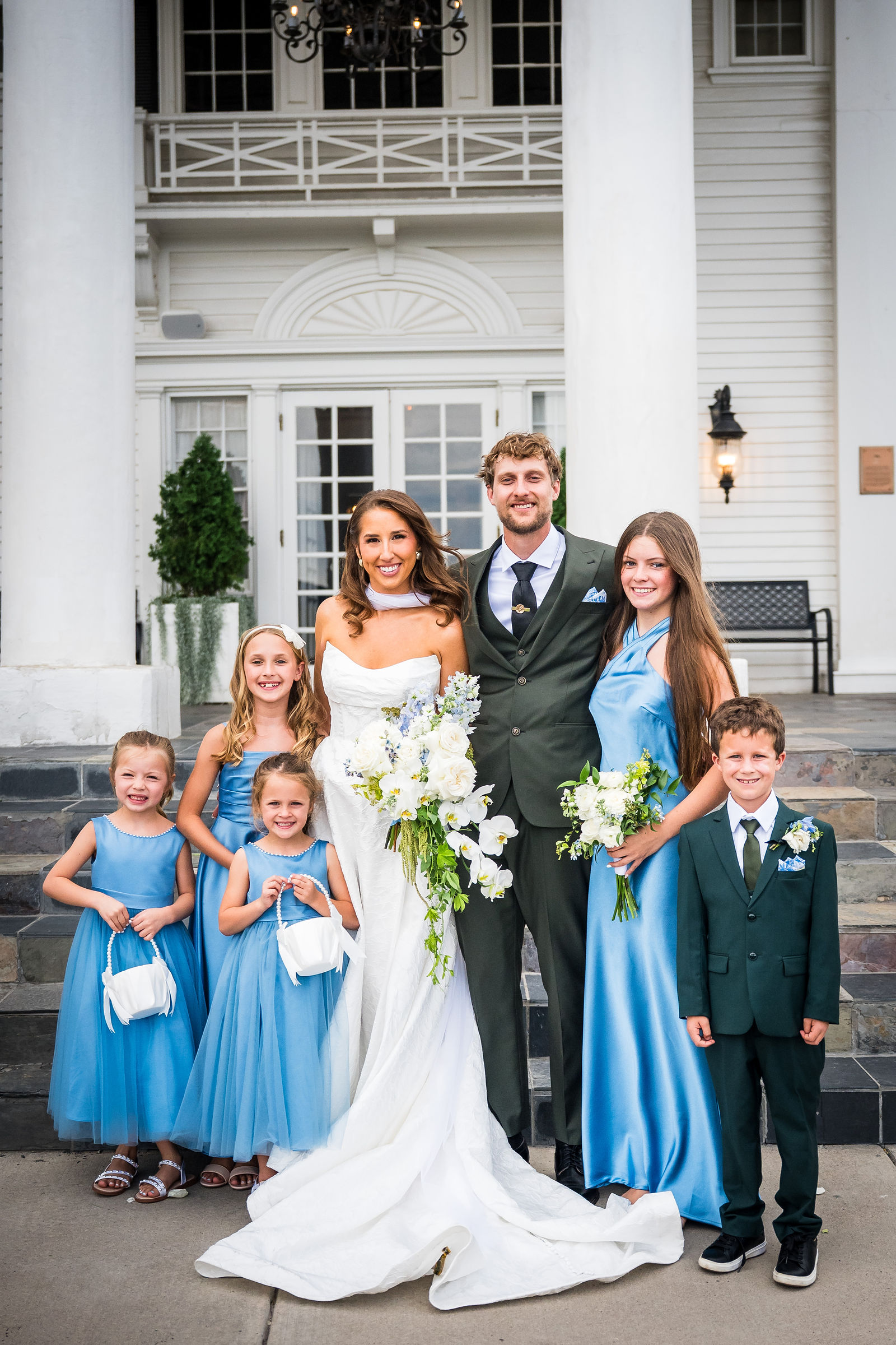 Bride and groom with their flower girls and ring bearers at the Manor House