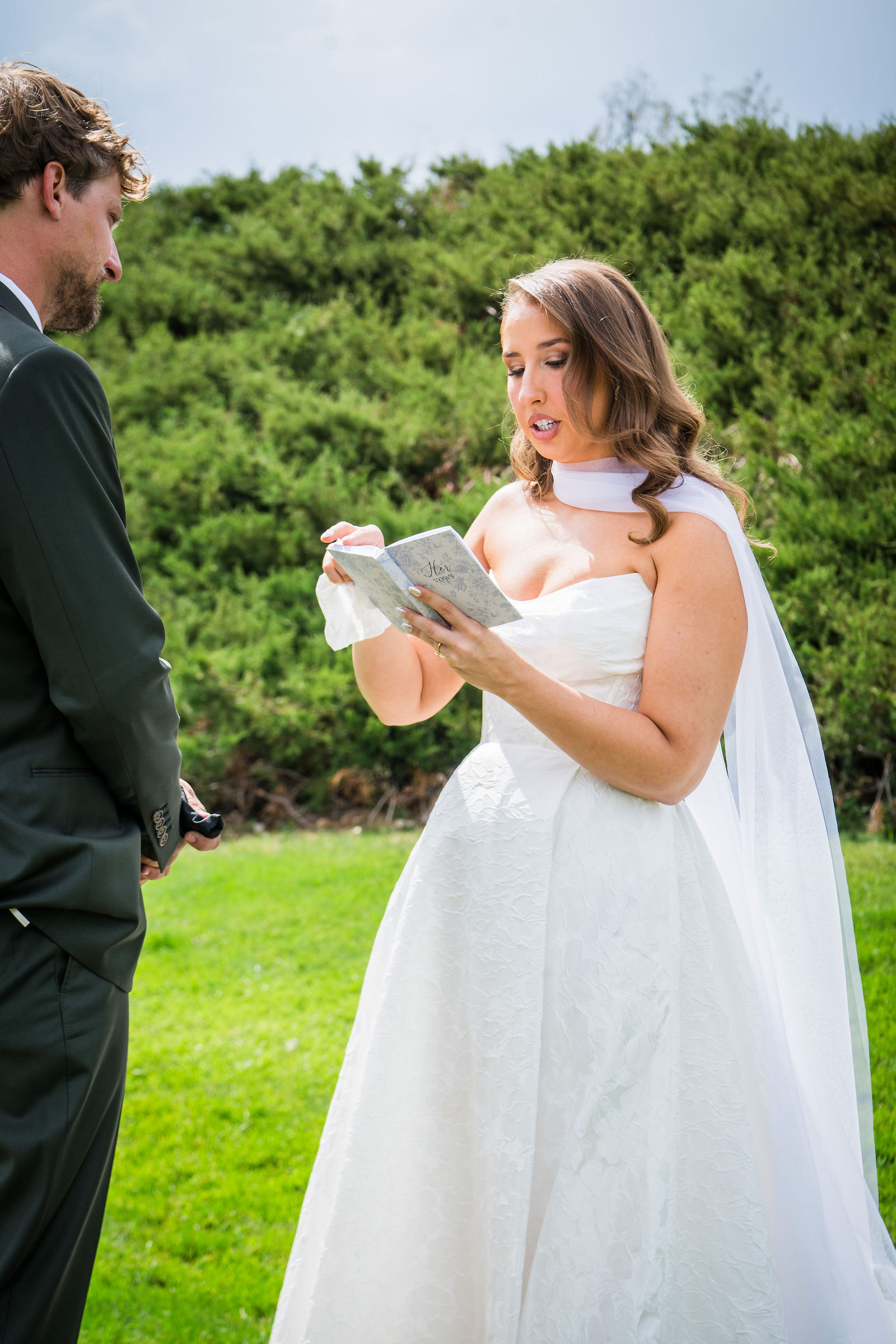 Bride reading her handwritten vows to her groom at the Manor House