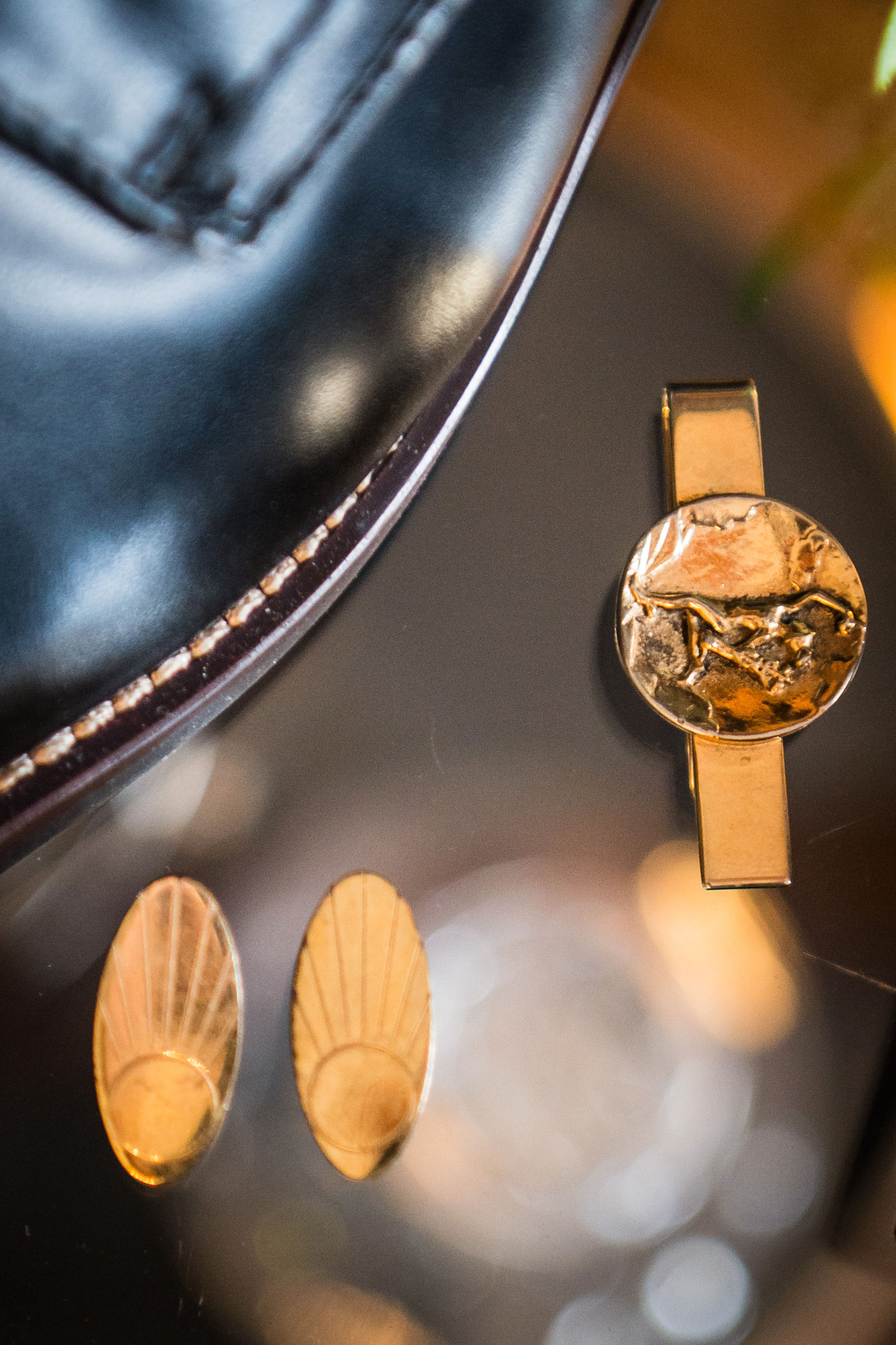 Groom’s gold watch and cufflinks on the morning of a Colorado wedding