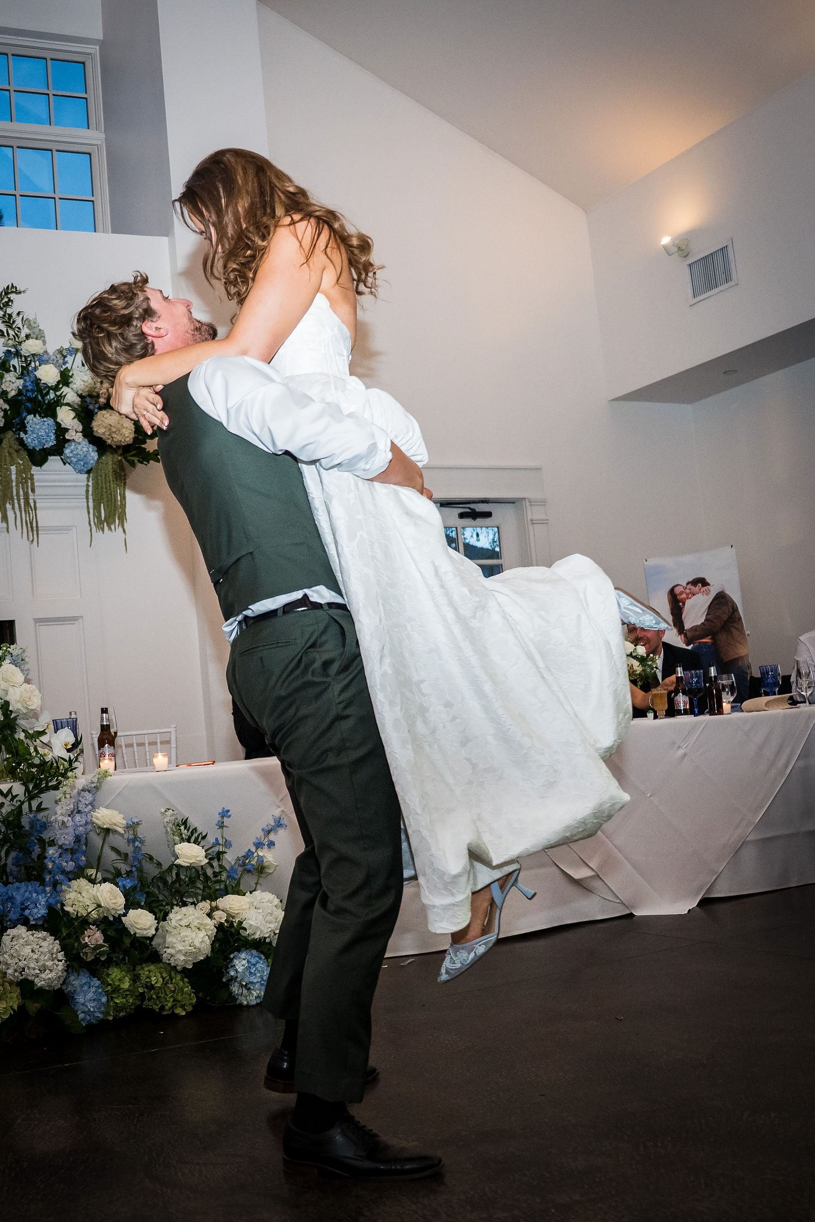 Groom lifting his bride during their first dance at the Manor House