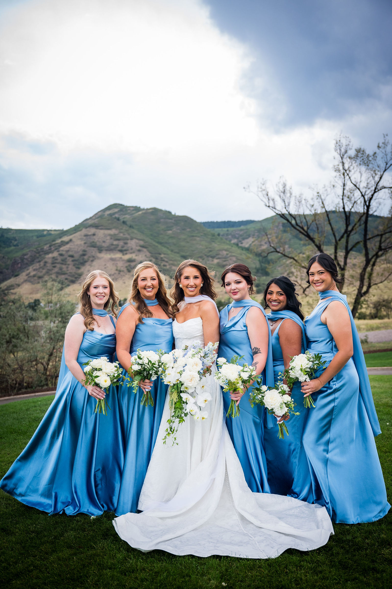 Bride and her bridesmaids with the foothills behind them