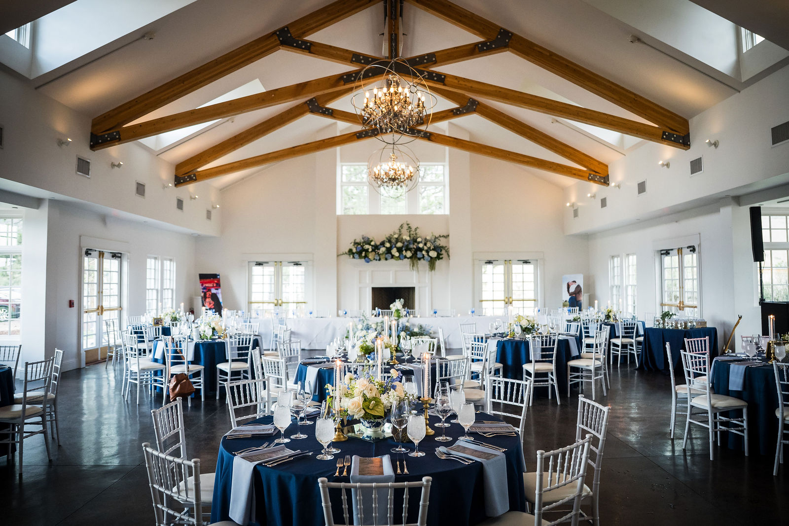 Reception room at the Manor House set with navy linens and blue glassware