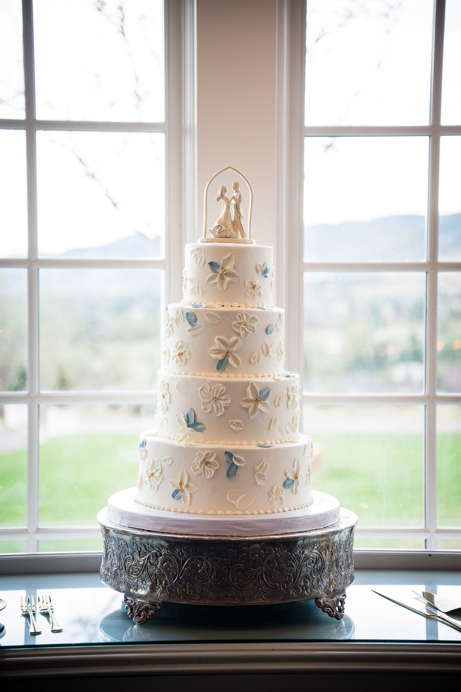 Tiered white wedding cake by The Makery at the Manor House
