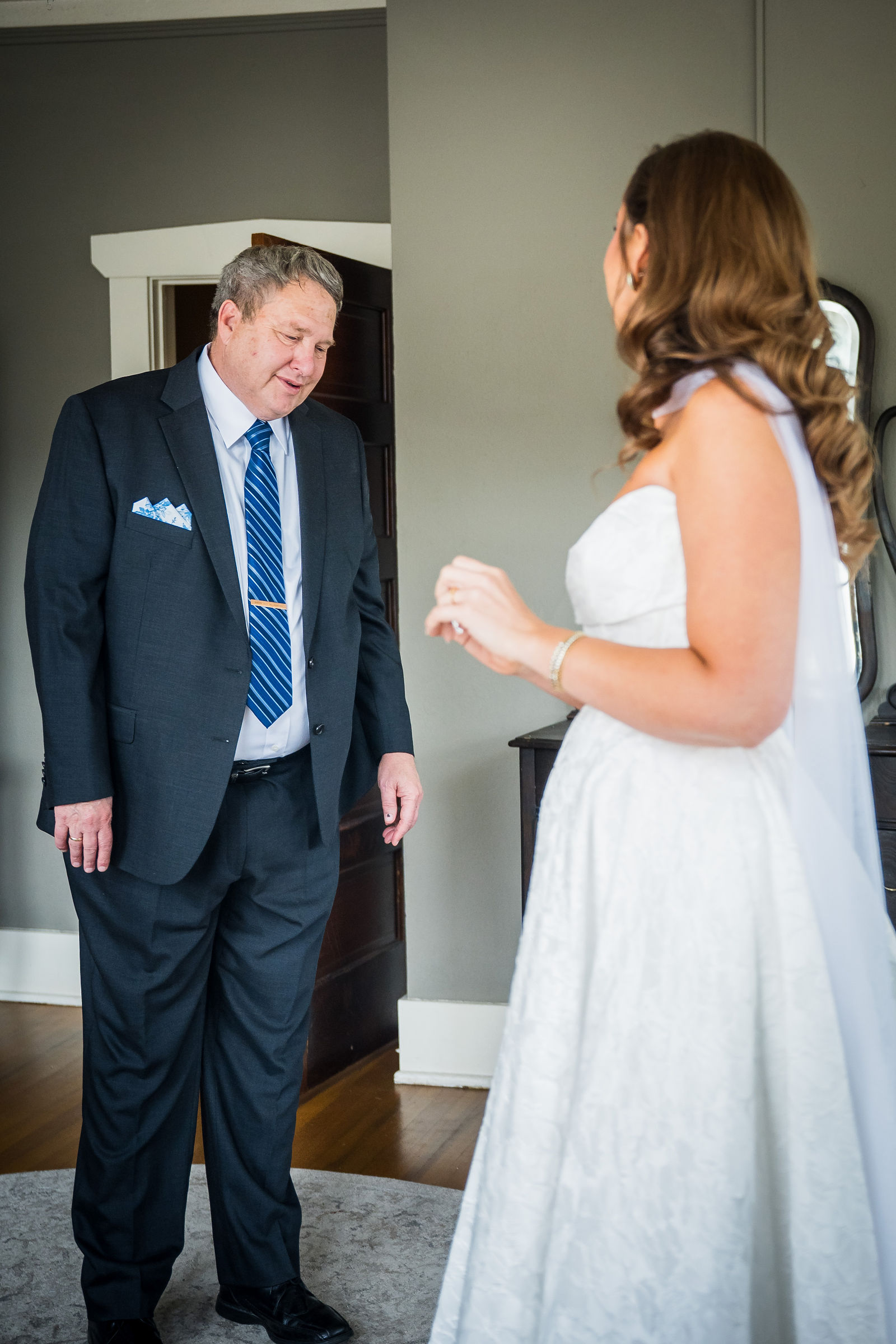 Bride and her father during their first look before a Colorado wedding