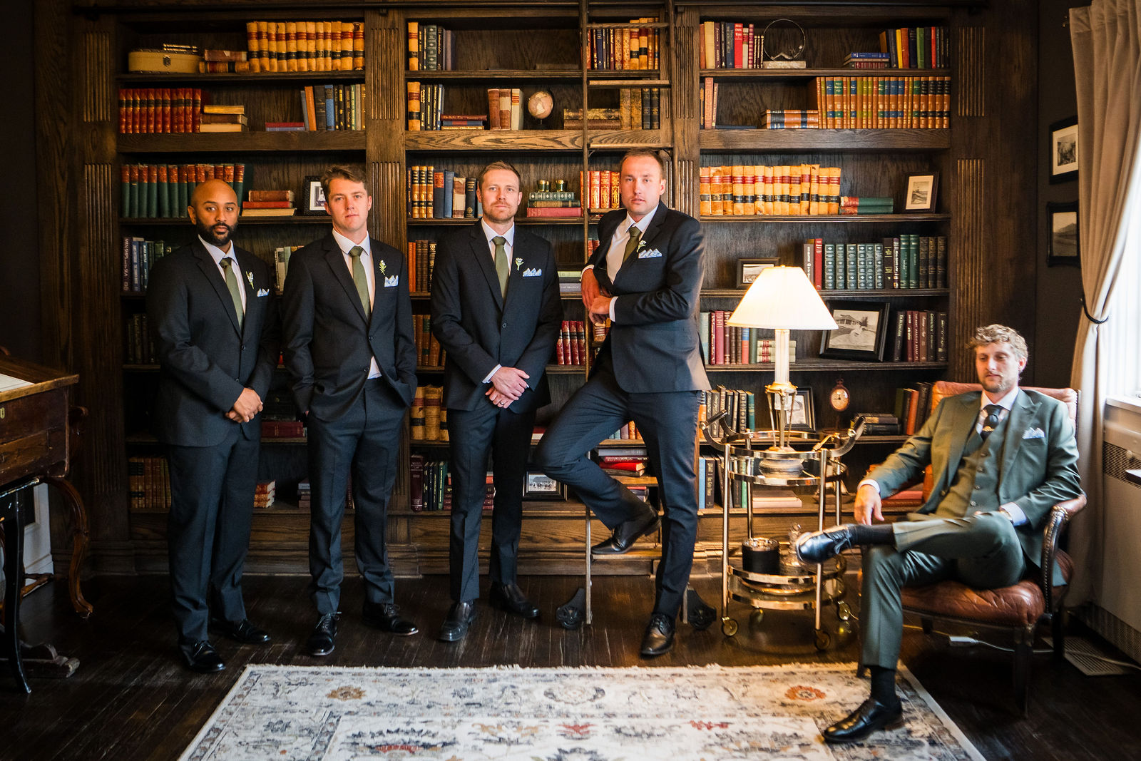 Groomsmen in the library at the Manor House