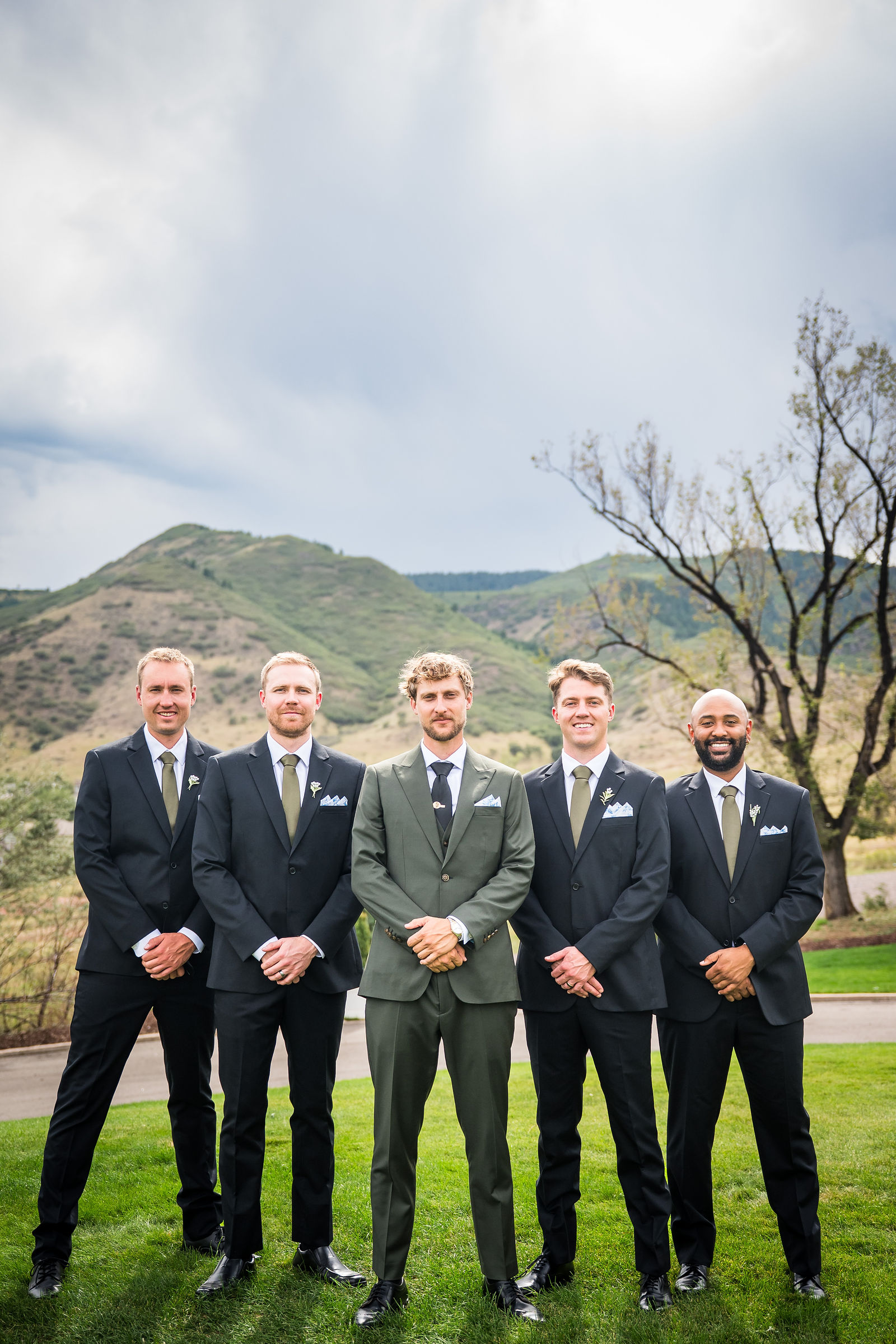 Groom and groomsmen with the Colorado foothills behind them