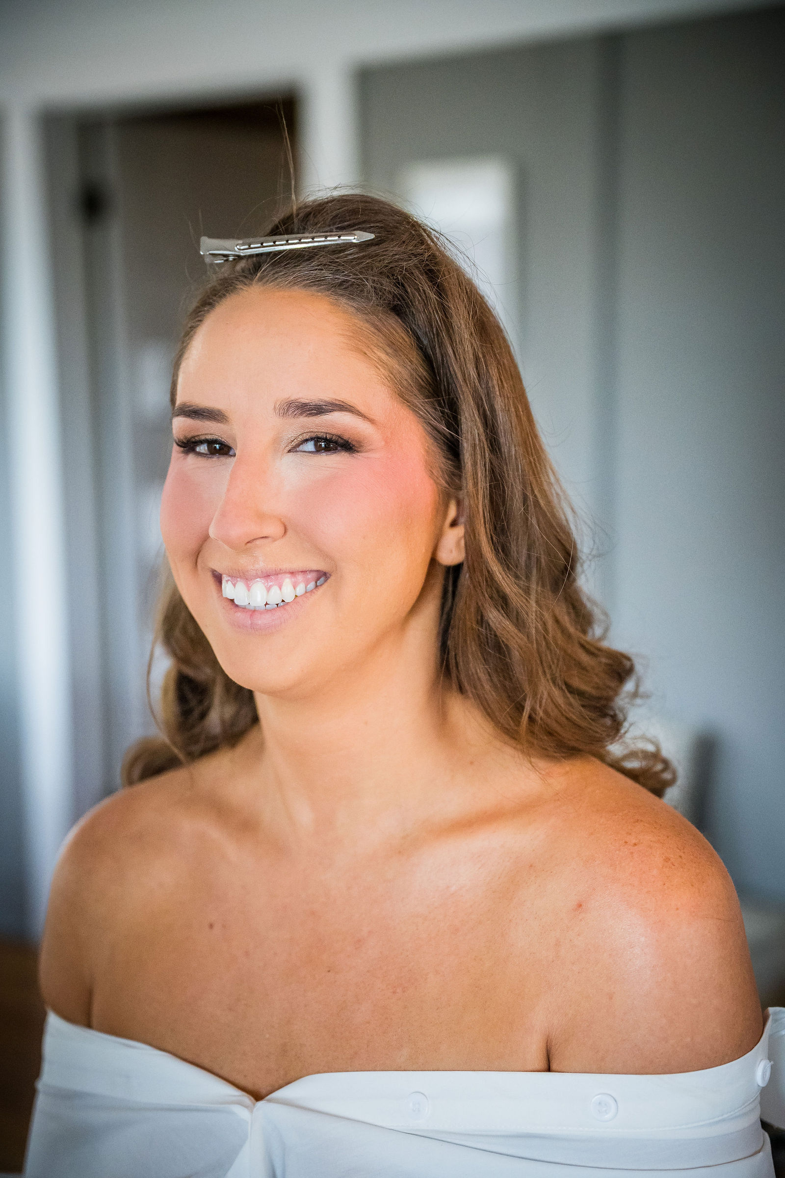 Bride with her hair and makeup finished before her Manor House wedding
