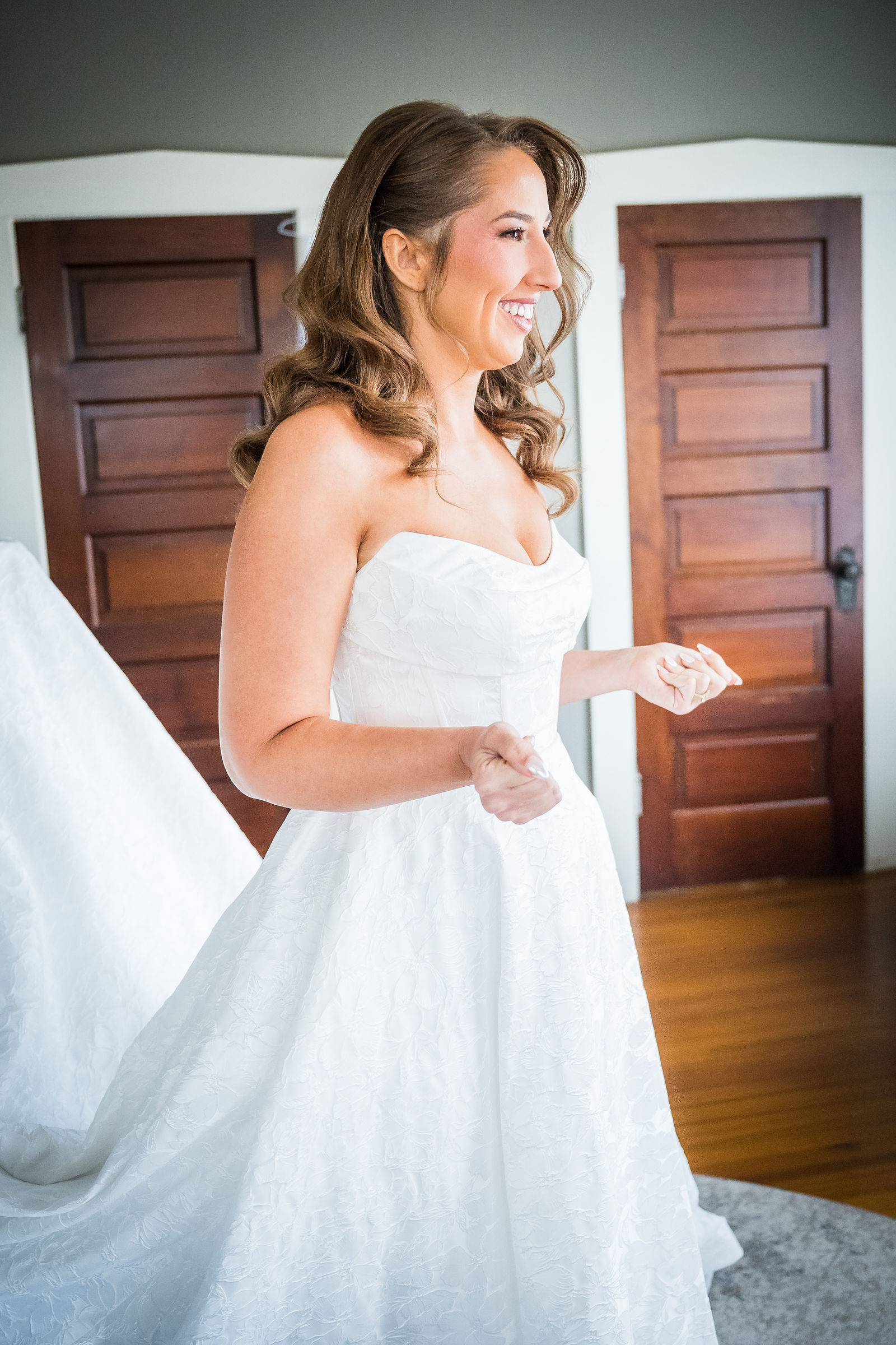 Bride holding her mother’s engraved handkerchief before a Manor House wedding