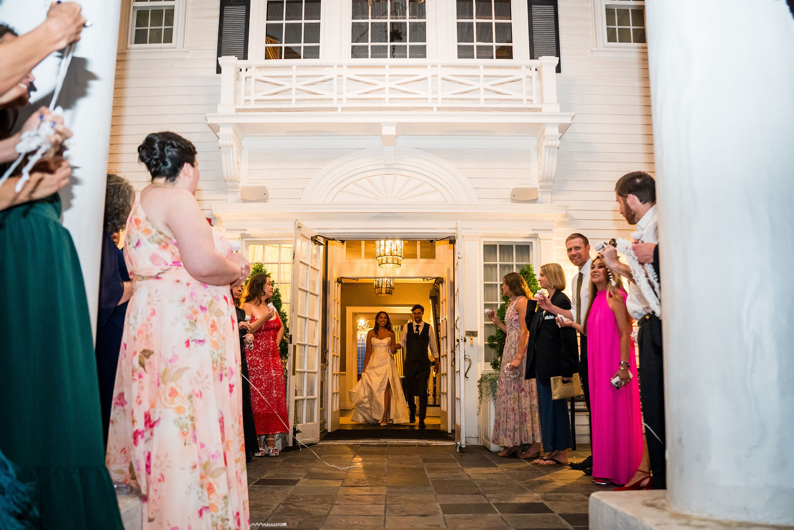 Guests lining the Manor House porch for the wedding exit