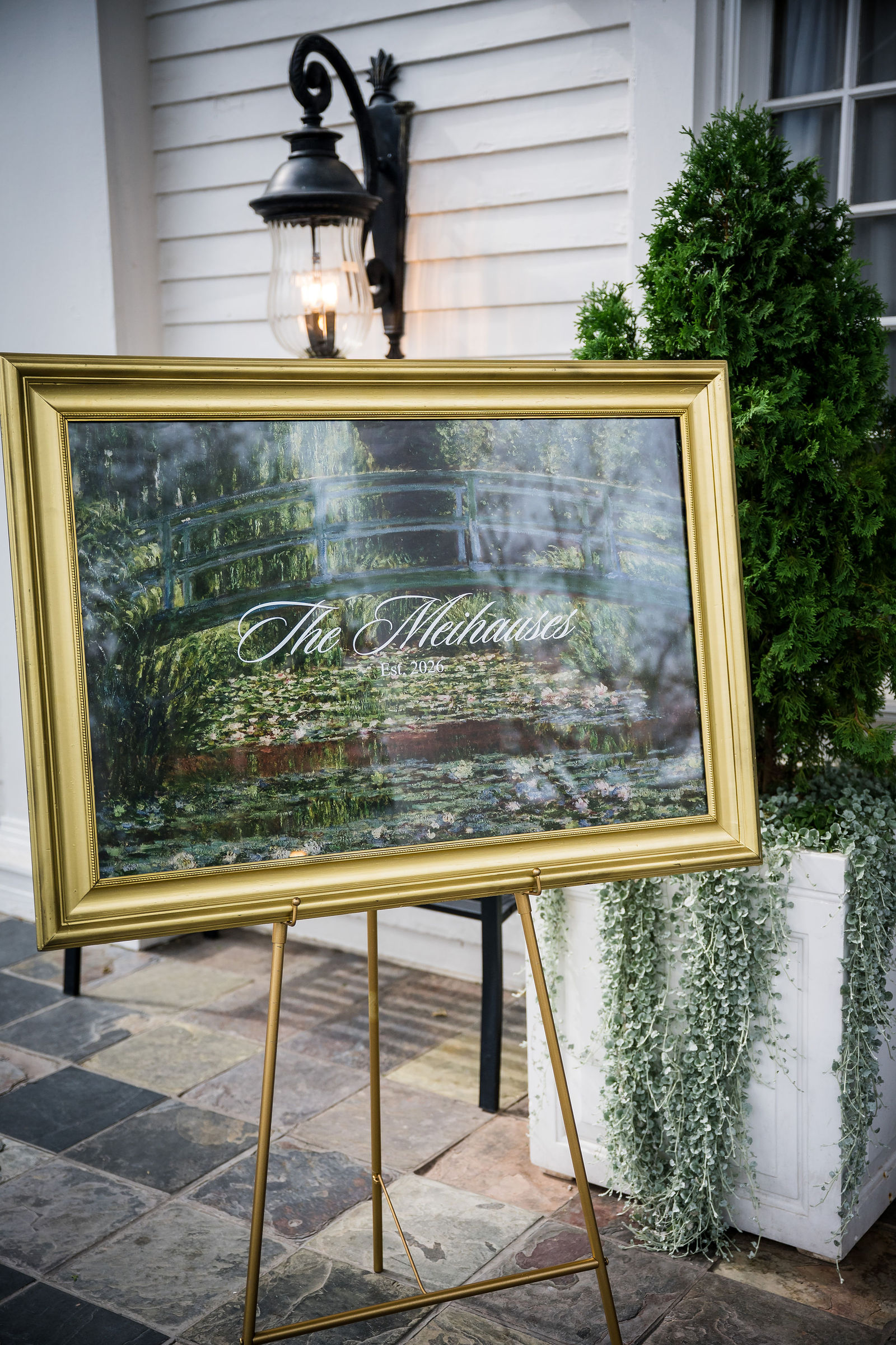 Framed engagement photo on an easel welcoming guests to a Manor House wedding