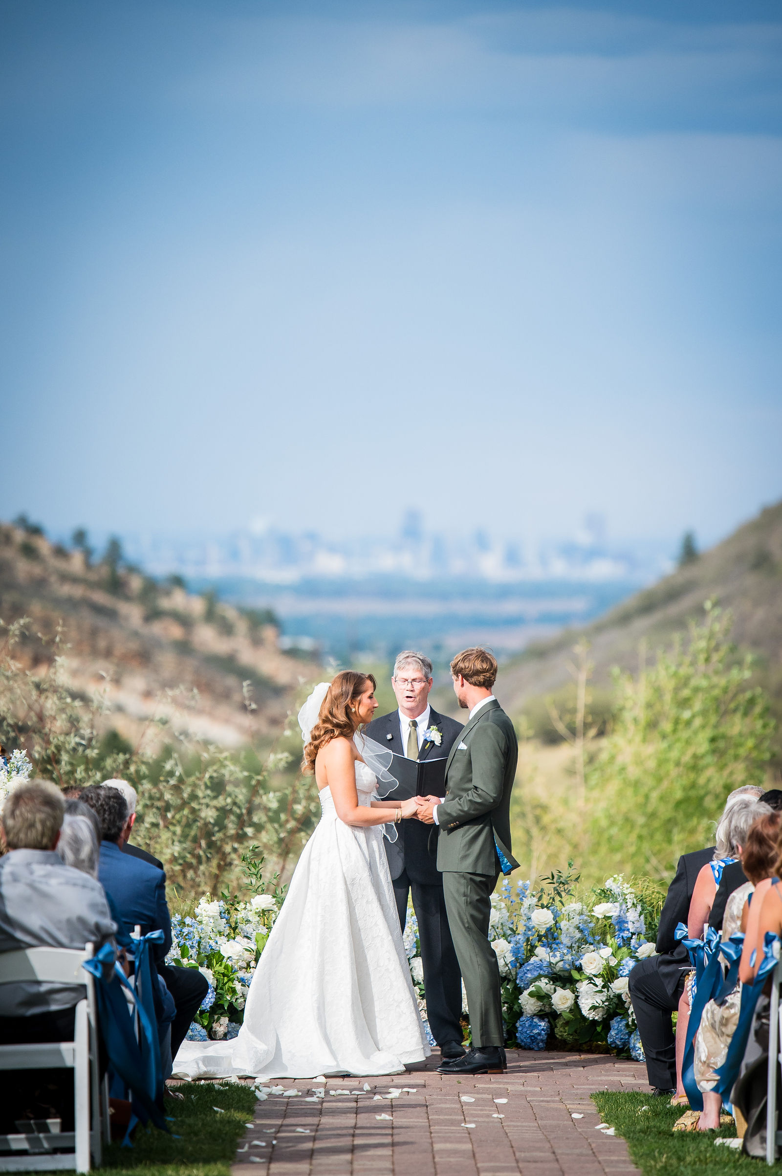 Wedding ceremony at the Manor House with the Denver skyline in the distance