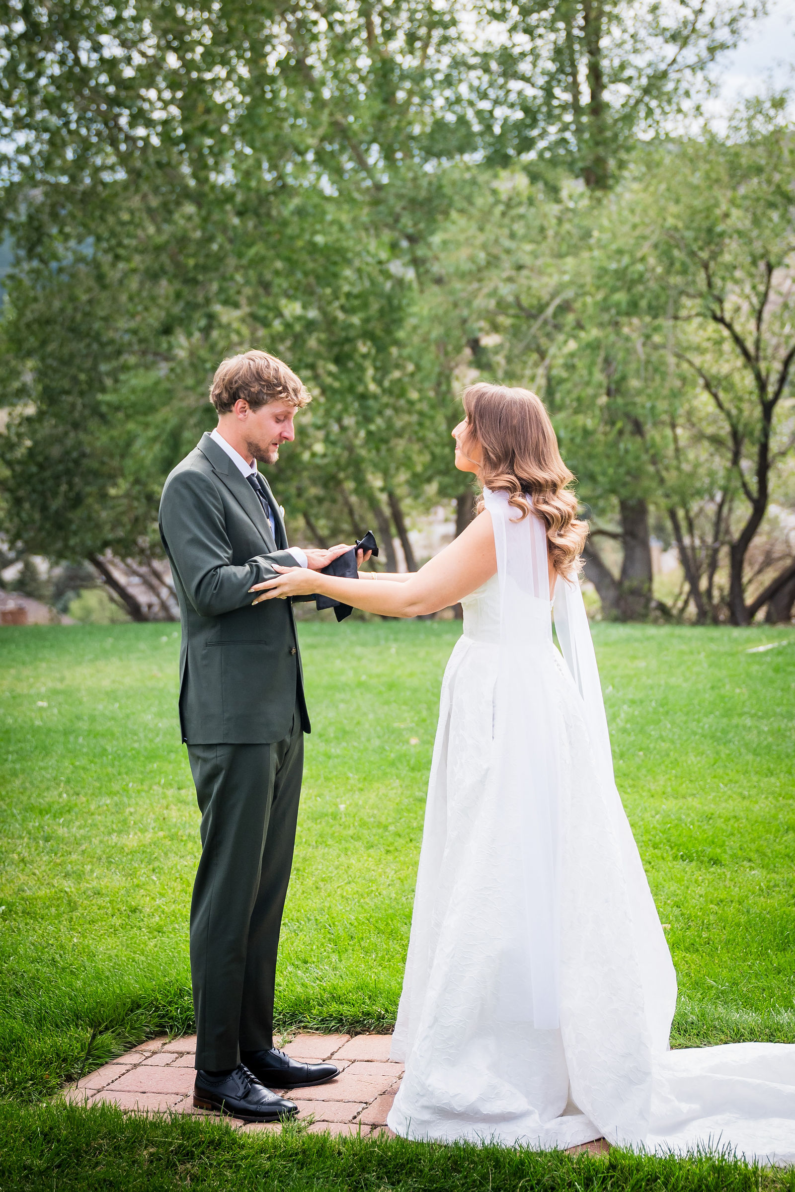 Couple reading private vows to each other on the Manor House lawn