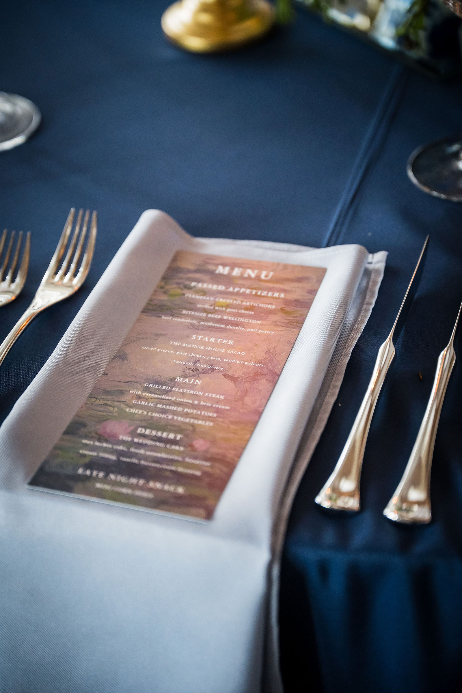 Wedding menu card on a navy tablecloth at a Littleton Colorado reception
