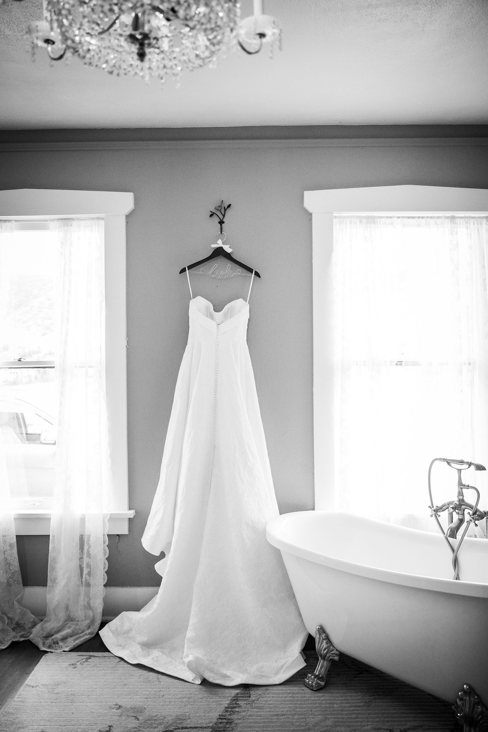 Wedding dress hanging in a window at the Manor House in Littleton Colorado