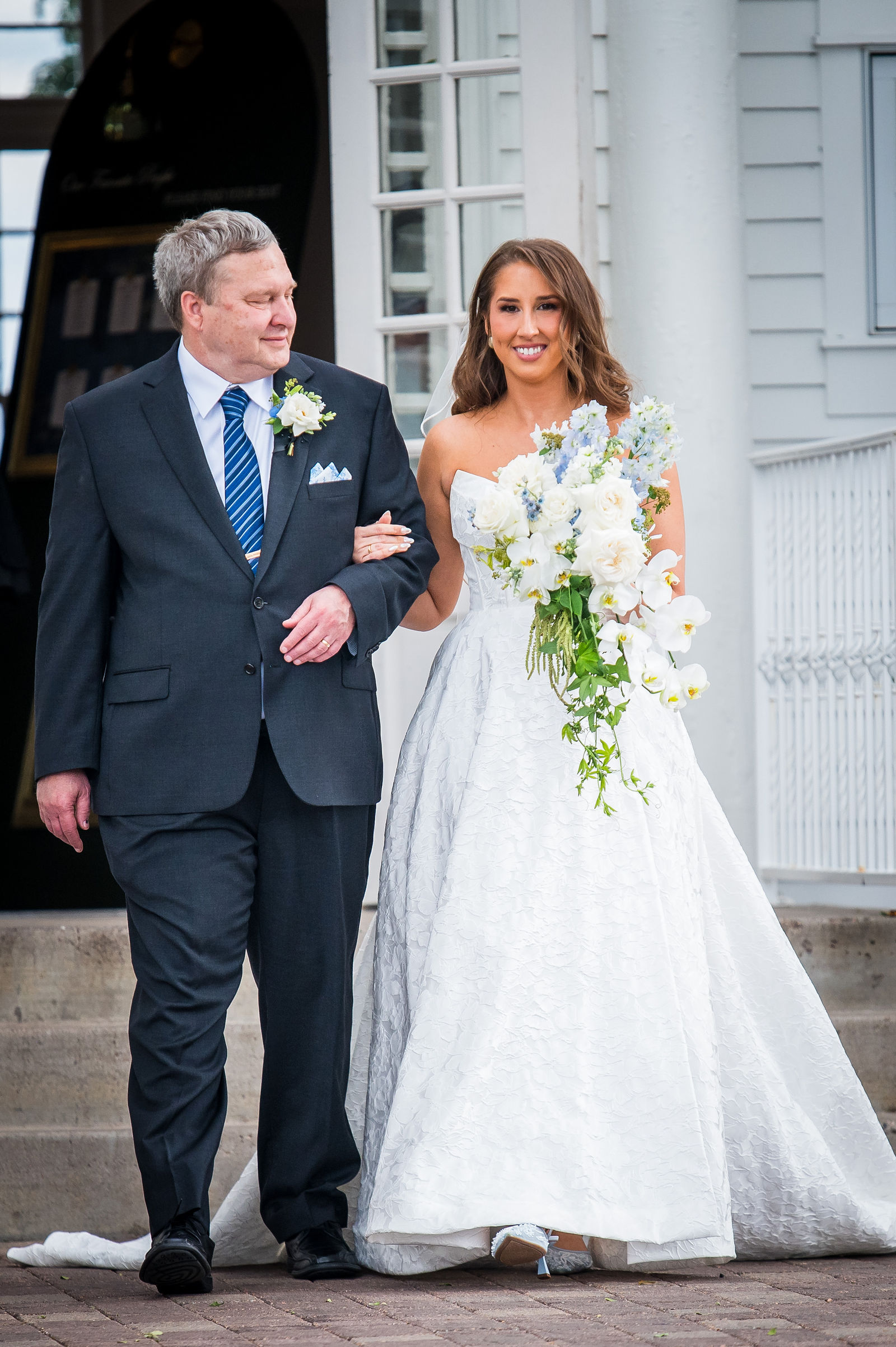 Father of the bride walking his daughter down the aisle at the Manor House