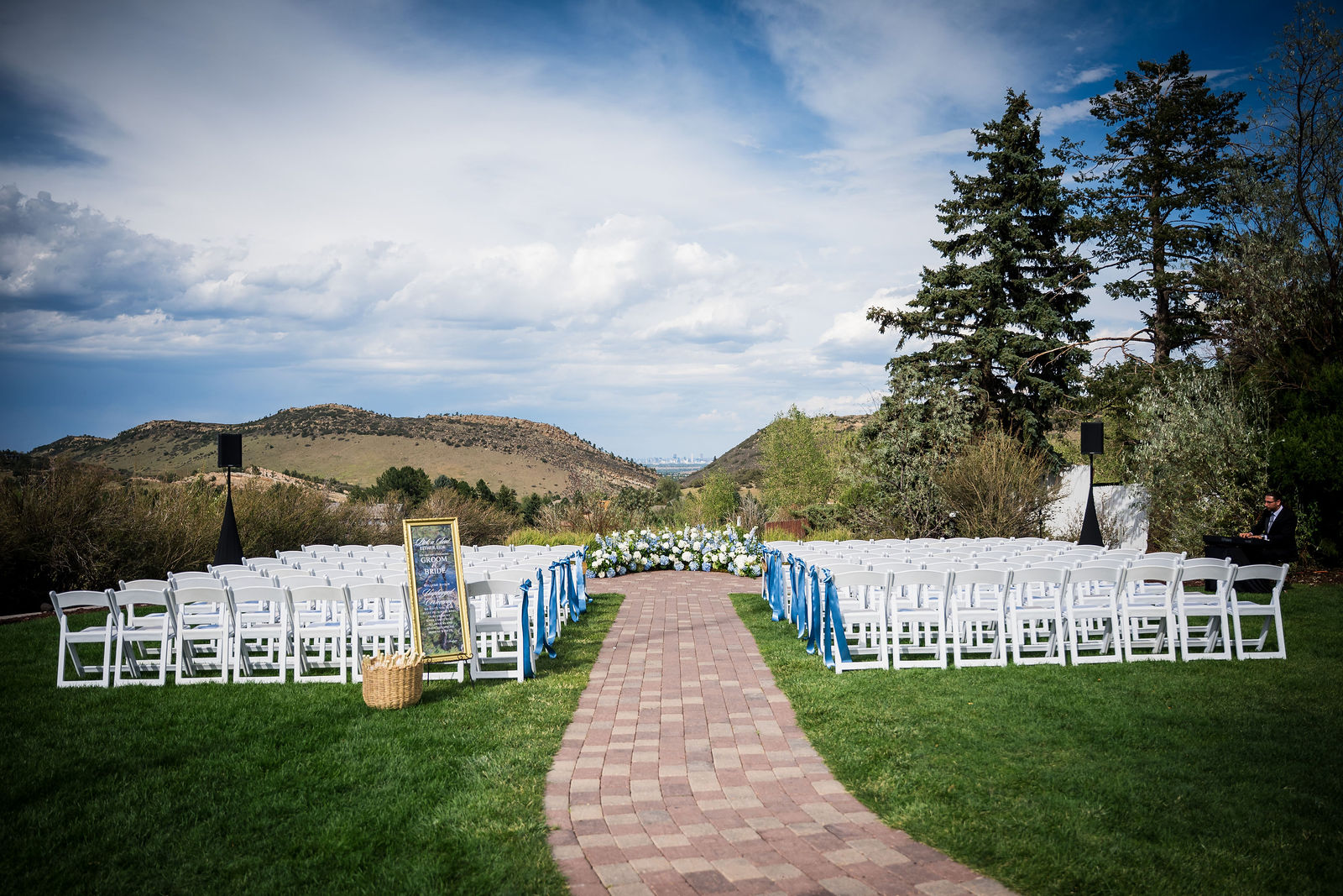 Ceremony lawn at the Manor House set for a wedding with the Colorado foothills behind