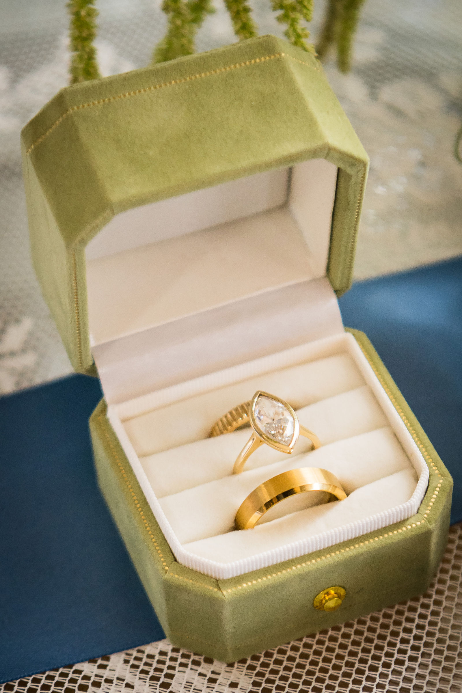 Wedding rings in a gold box on the morning of a Manor House wedding