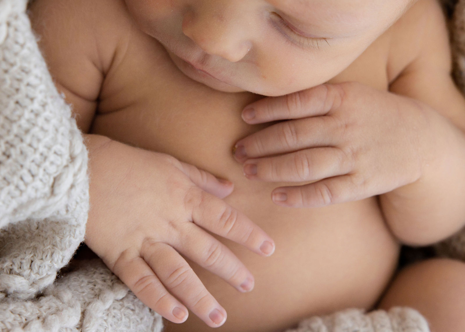 Utah newborn photographer capturing sleepy newborn within first two weeks