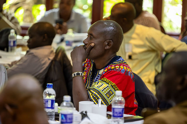 Participants listen together during a training session