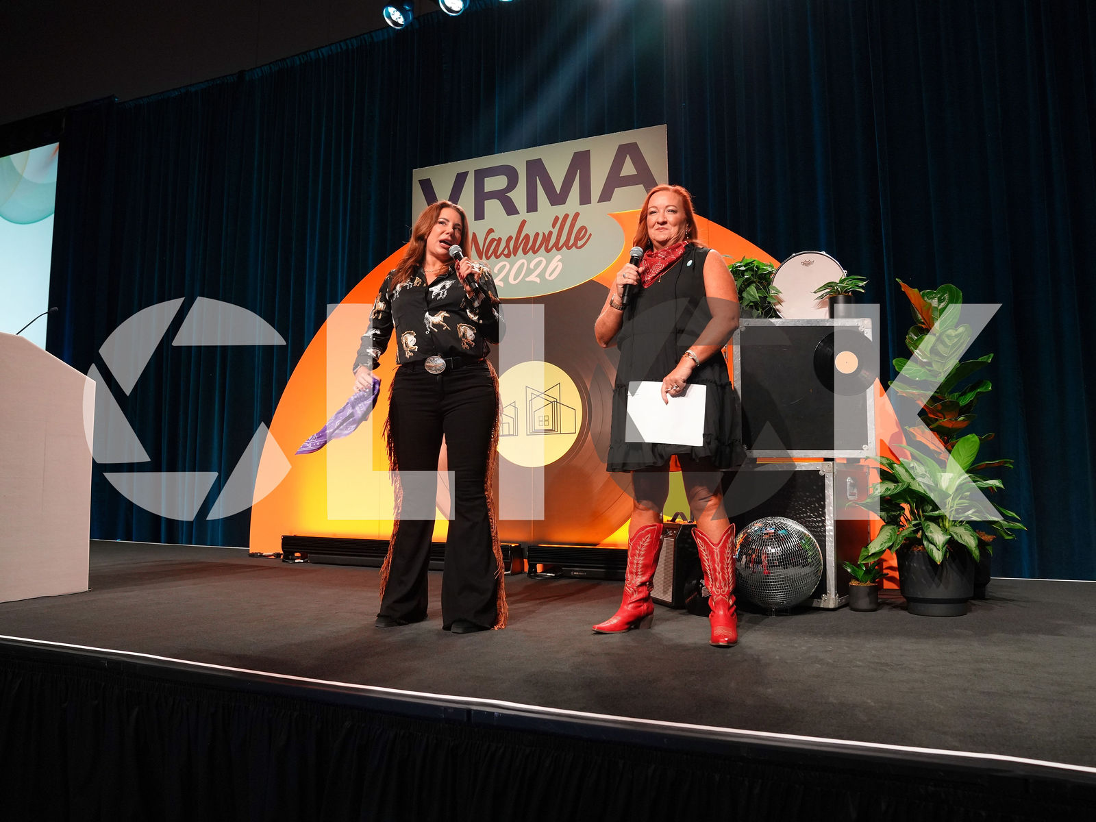 Two hosts on the main stage at VRMA 26 Nashville