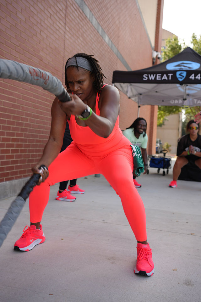 An athlete working the battle ropes at Parking Lot Takeover