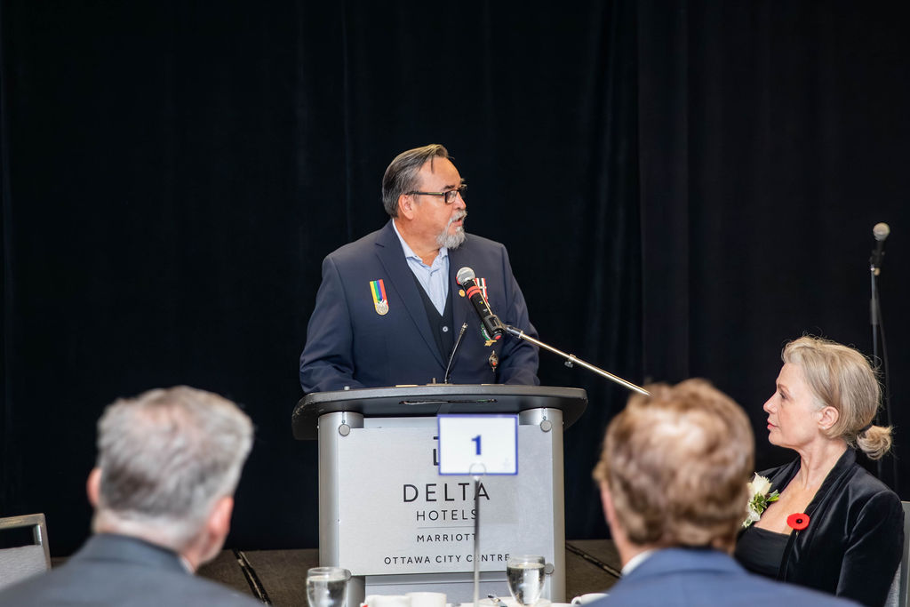 A veteran speaking to the room