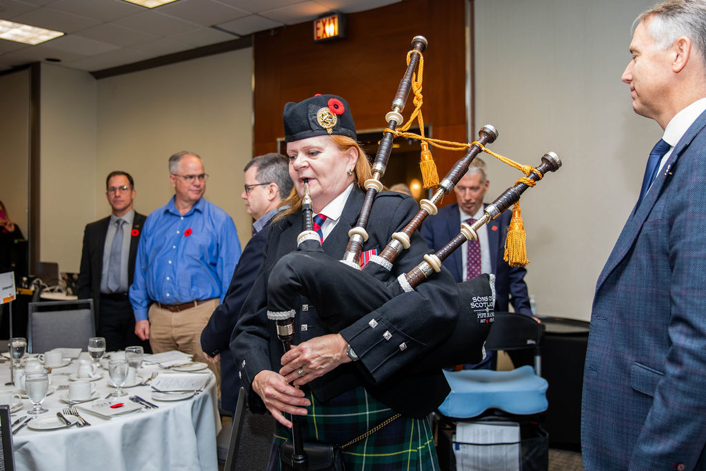 A piper leading the procession at the Ottawa Innercity Ministries Veterans' Tribute Lunch