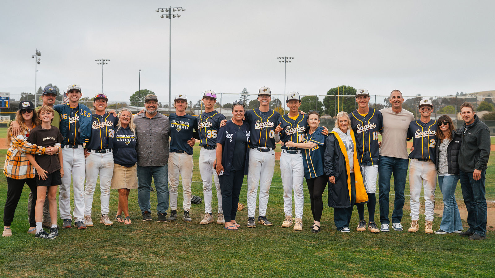 Arroyo Grande Eagles celebrate after winning the CIF Semi Final — seniors, teammates, families