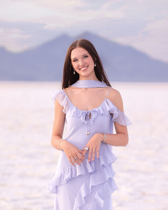 Bonneville Salt Flats senior photos with dramatic clouds and evening light