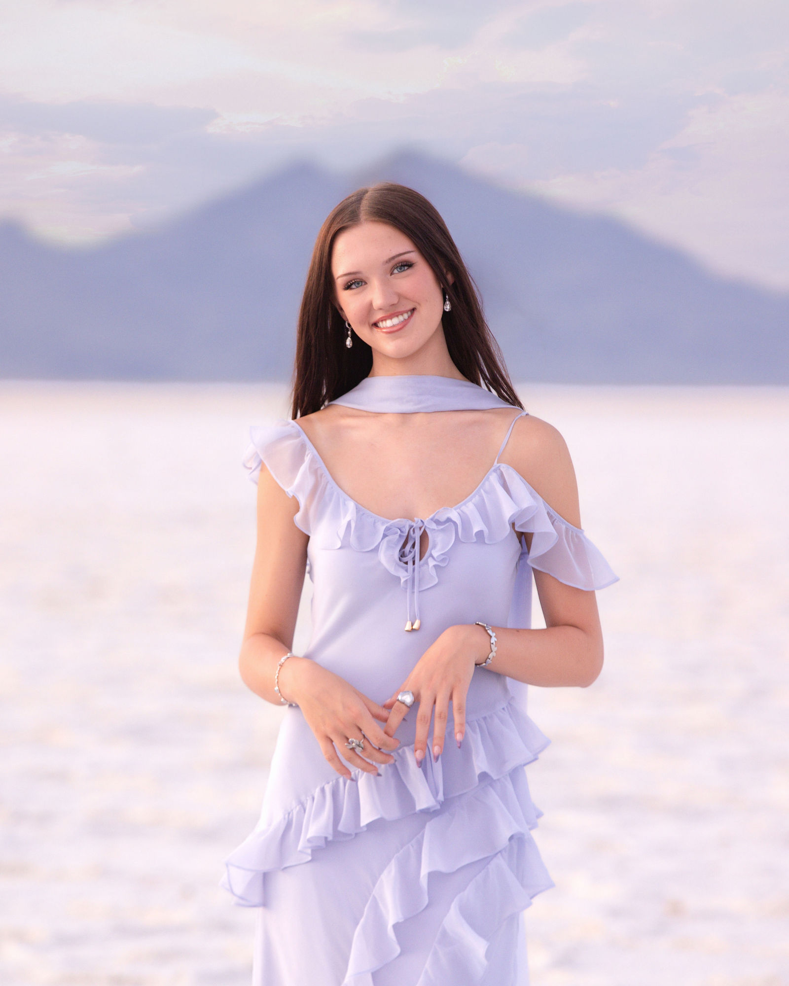 Bonneville Salt Flats senior photos with dramatic clouds and evening light