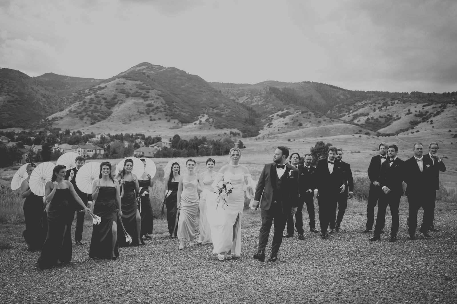 Wedding party on the lawn at The Manor House in warm sepia tone