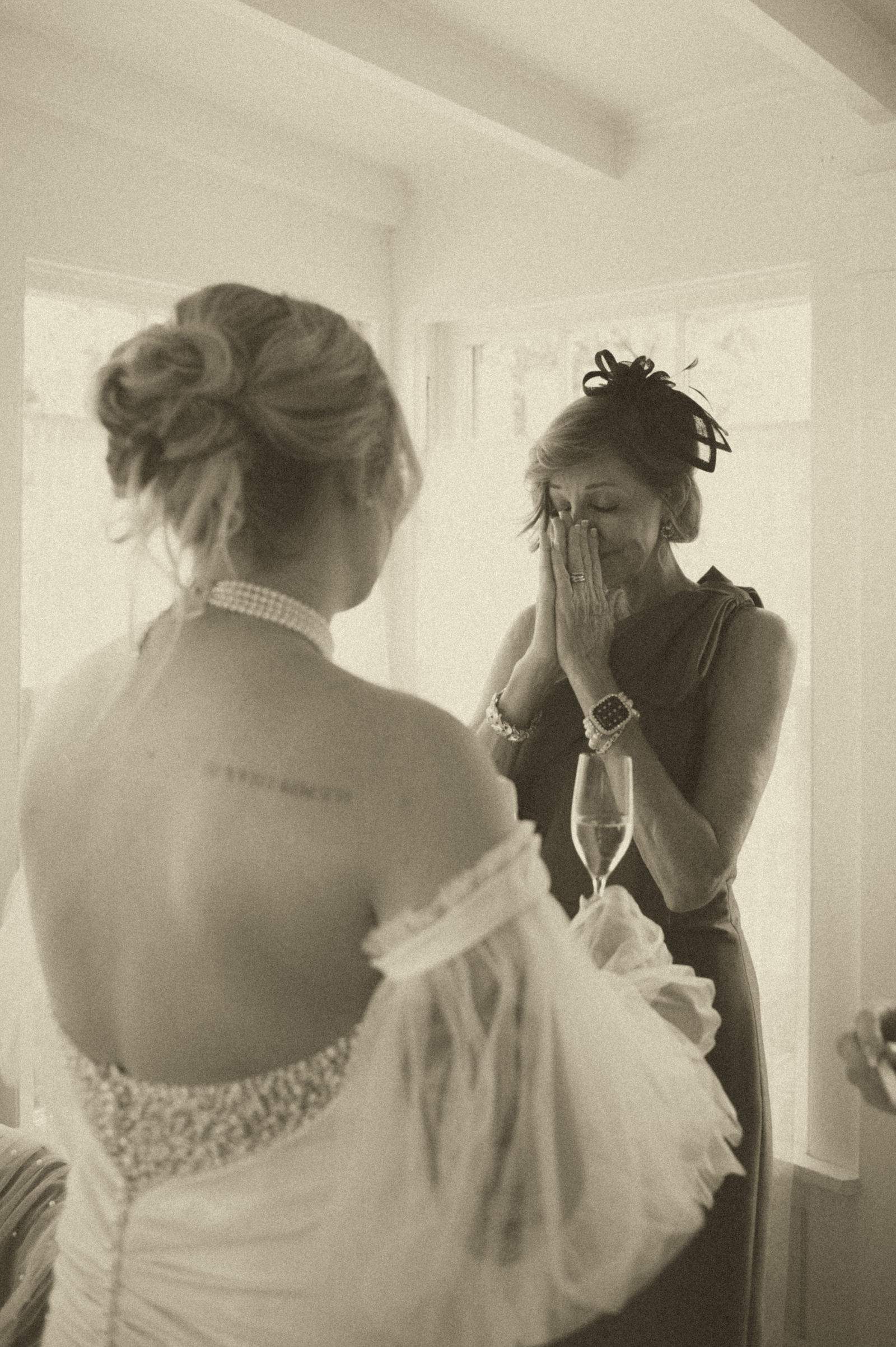 Bride and her mother embracing during their private first look
