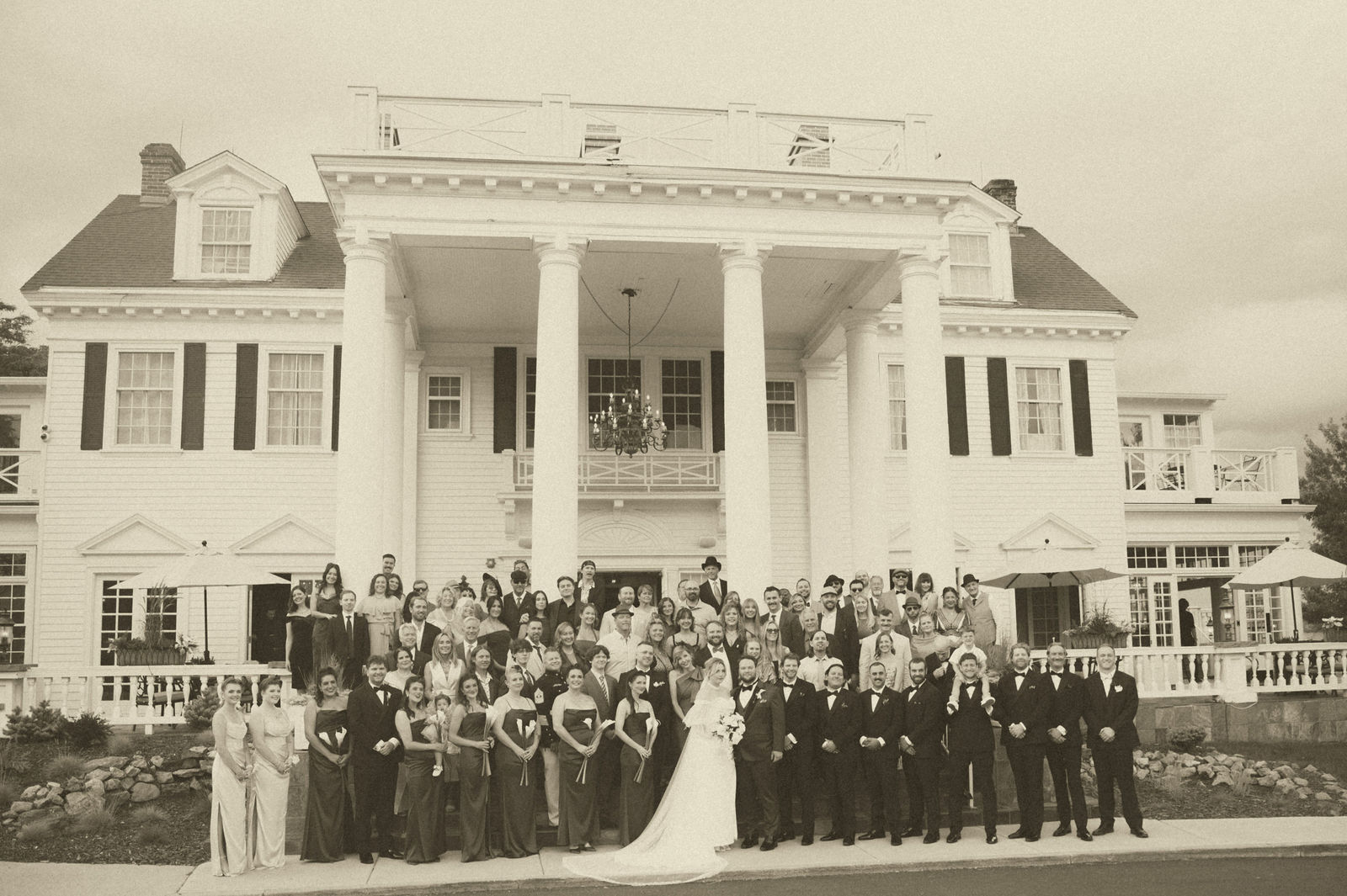 Large family portrait on the steps of The Manor House in Colorado
