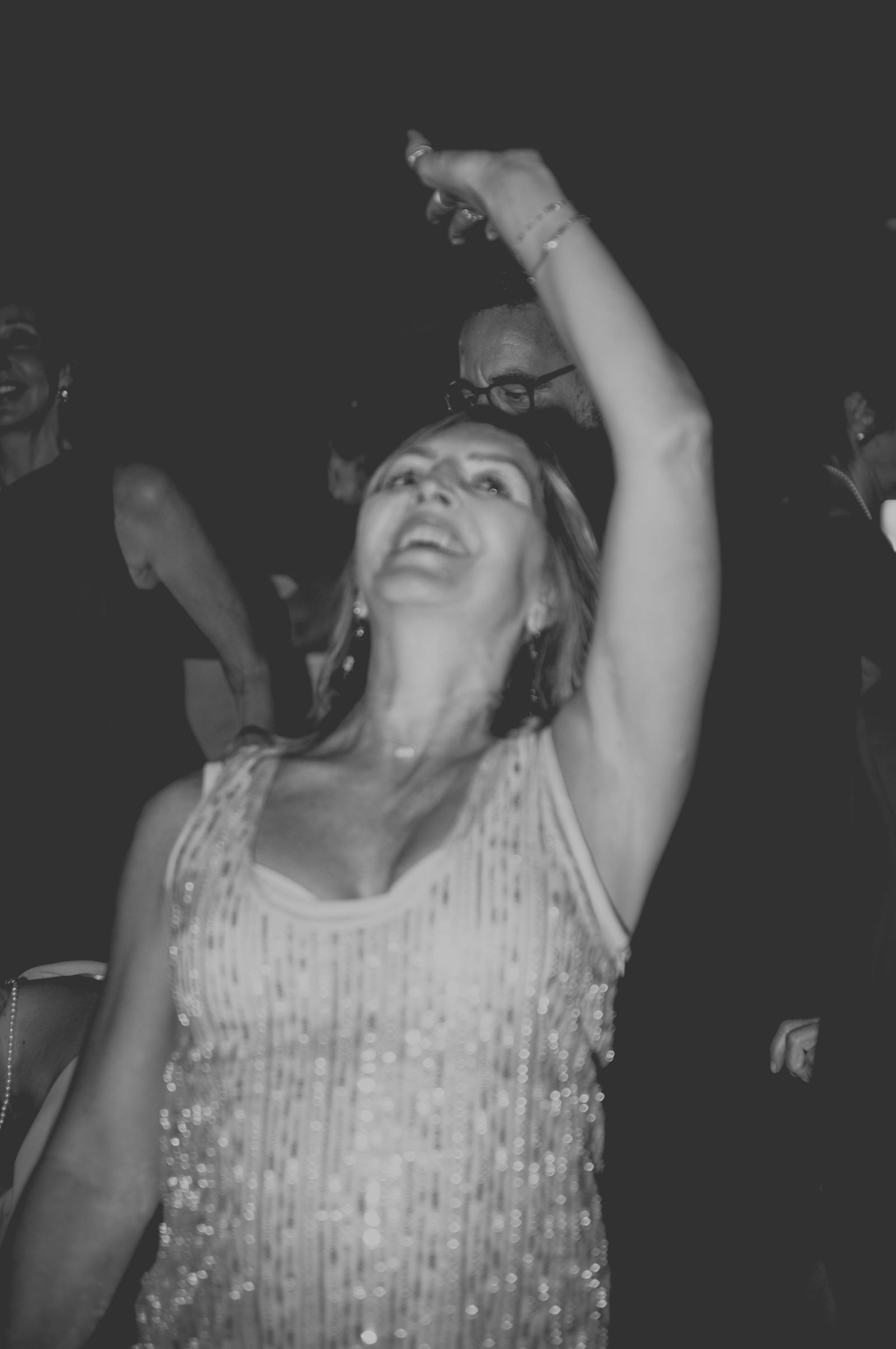 Guest laughing with joy on the dance floor at a Colorado wedding