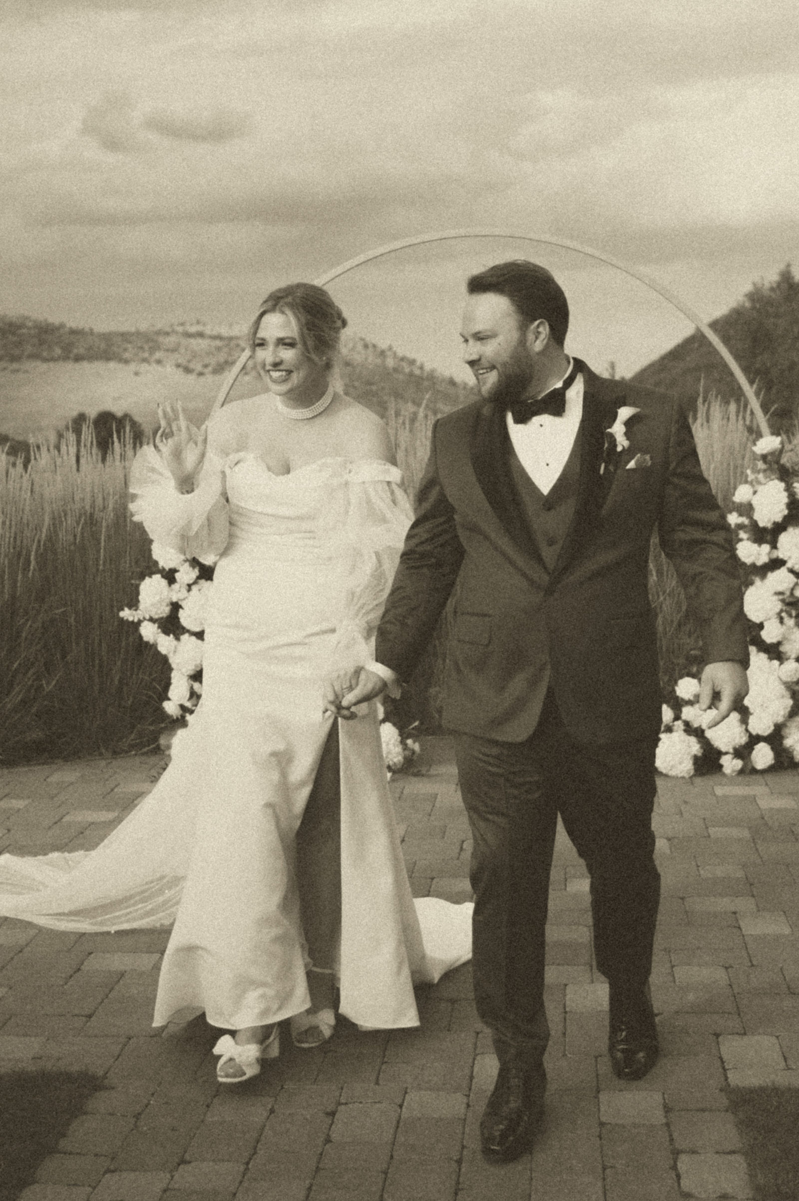 Joyful recessional back up the aisle at a Colorado vintage wedding