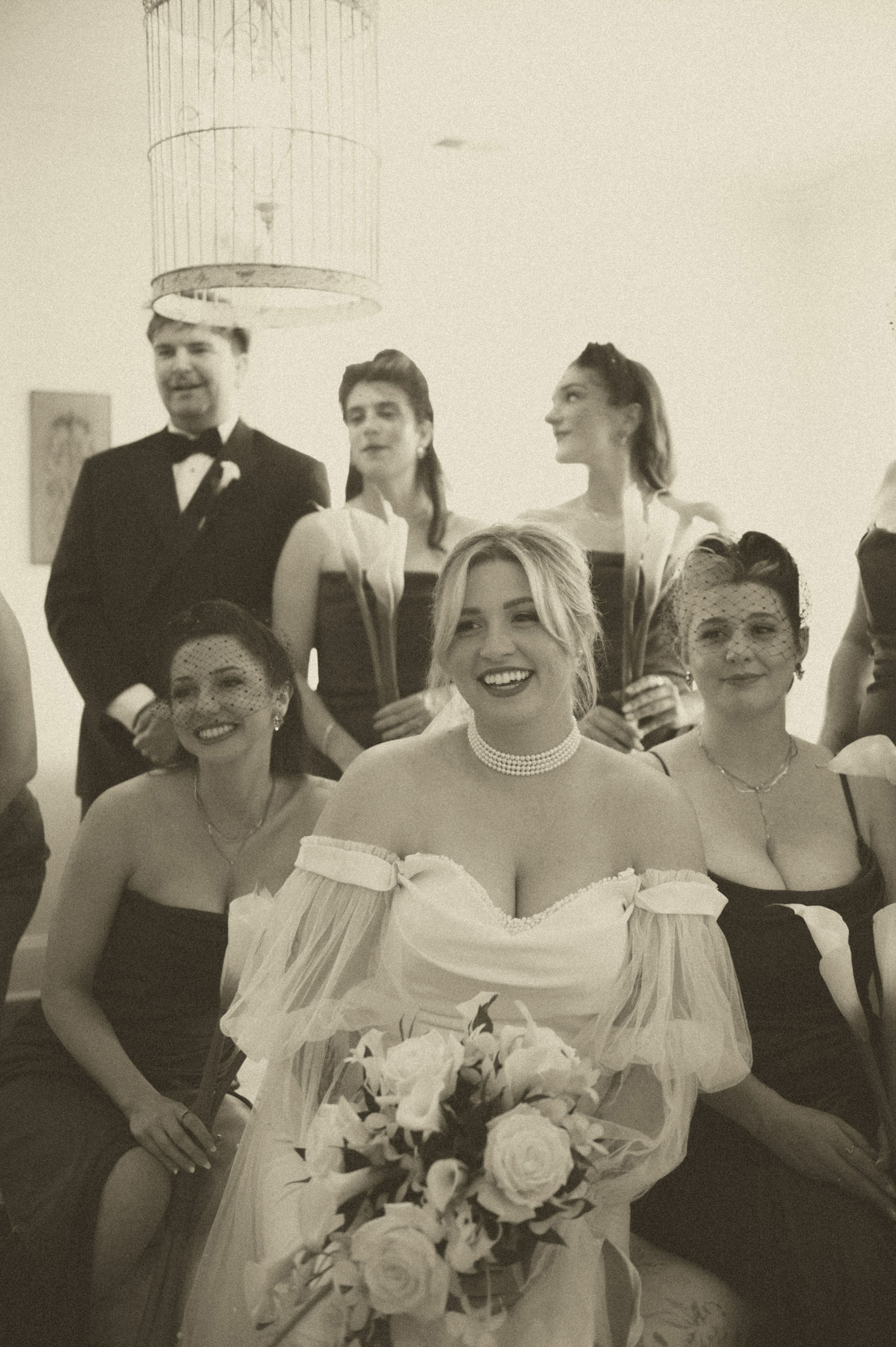 Bridesmaids reacting to seeing the bride in her dress for the first time