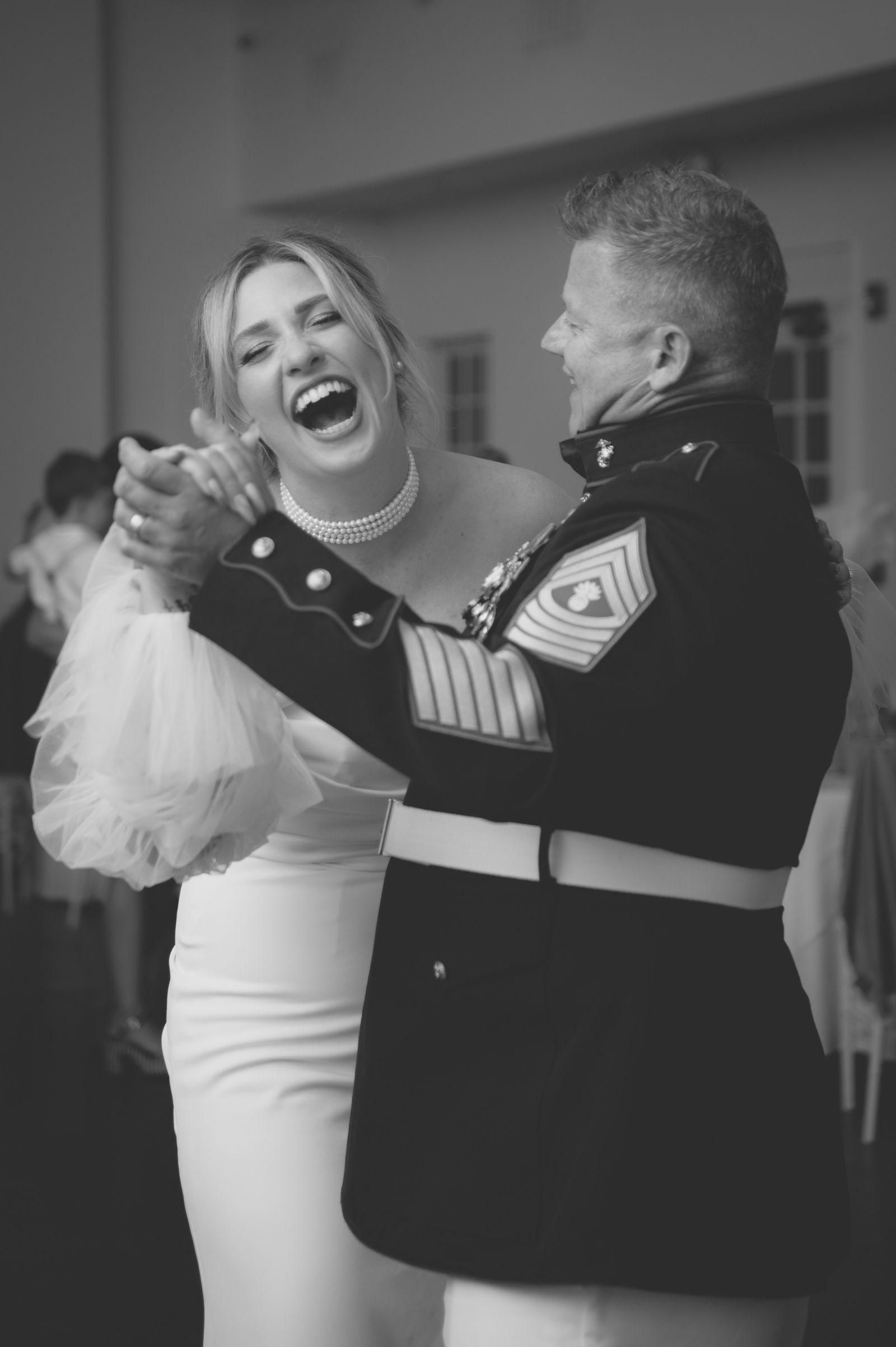 Guest in dress uniform dancing at a Colorado wedding reception