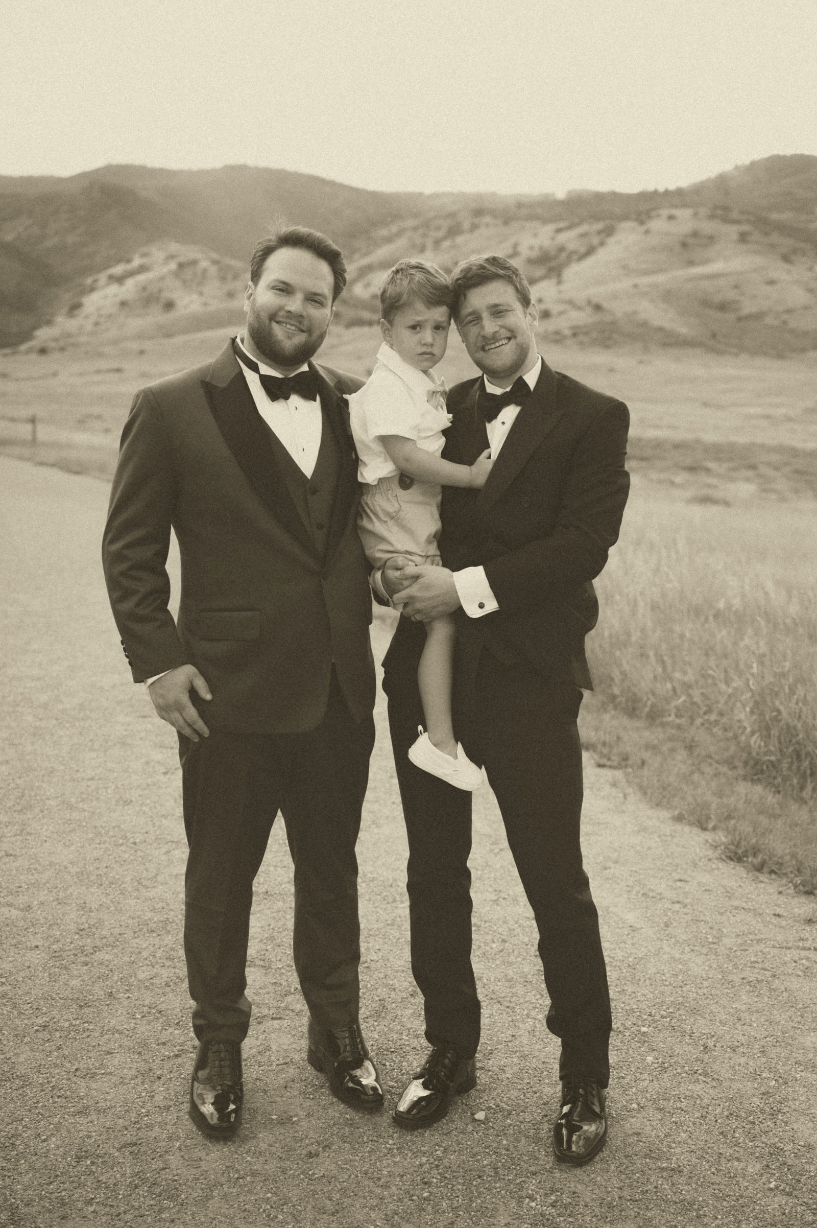 Groom with the ring bearers outside The Manor House Littleton
